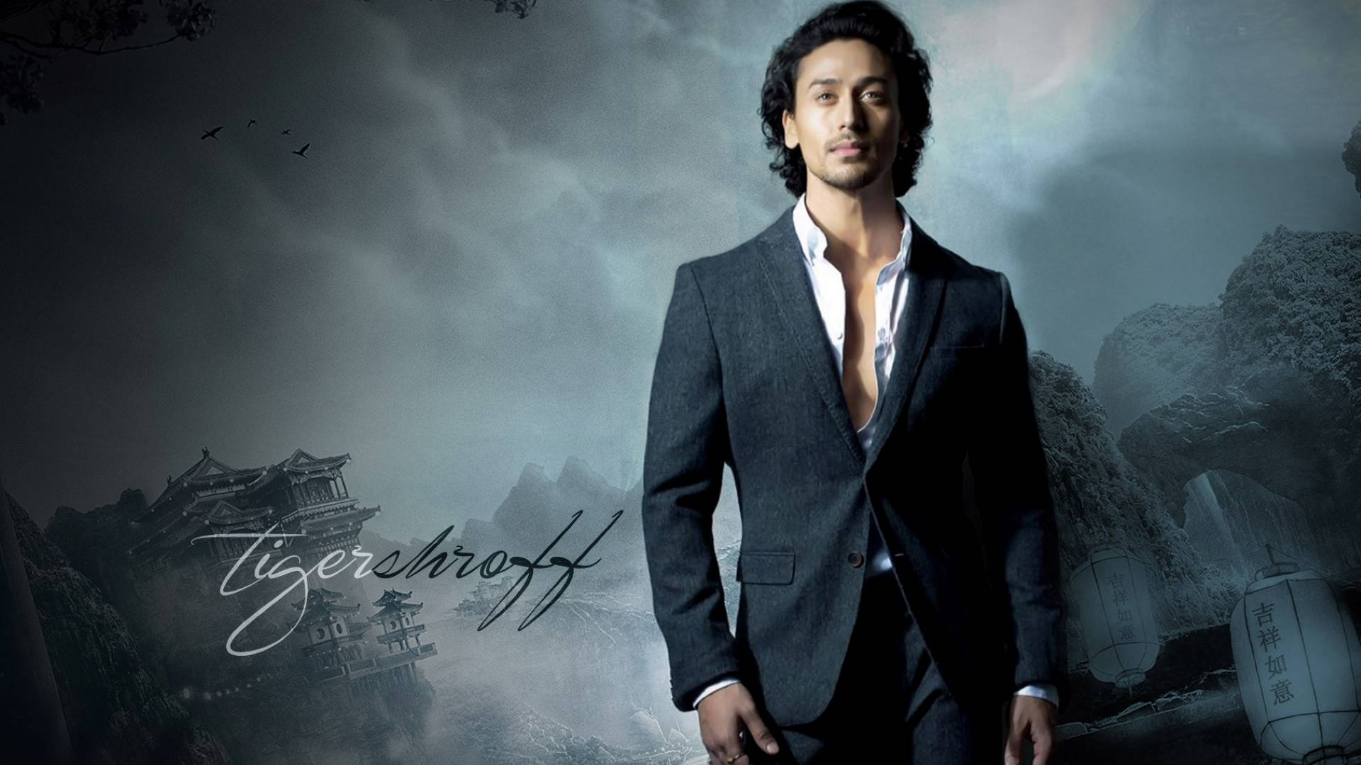 Tiger Shroff, dark suit, misty mountain backdrop, Full HD Desktop Wallpaper