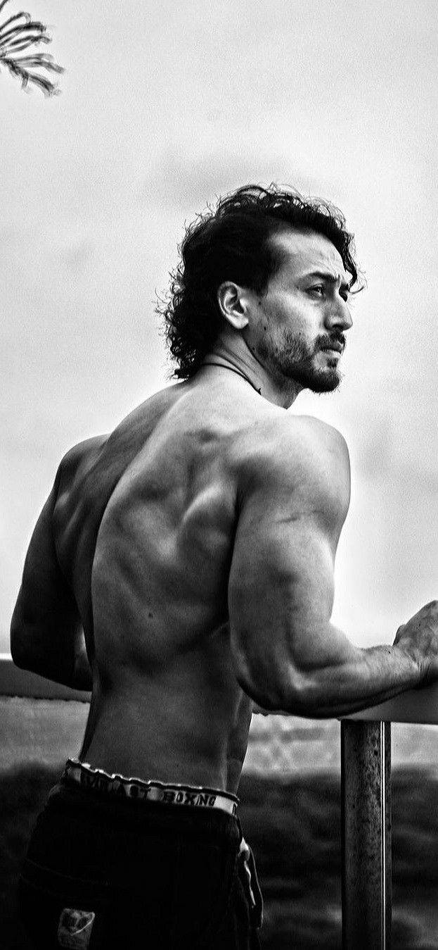 Tiger Shroff, black and white, gazing over a railing, HD Phone Wallpaper