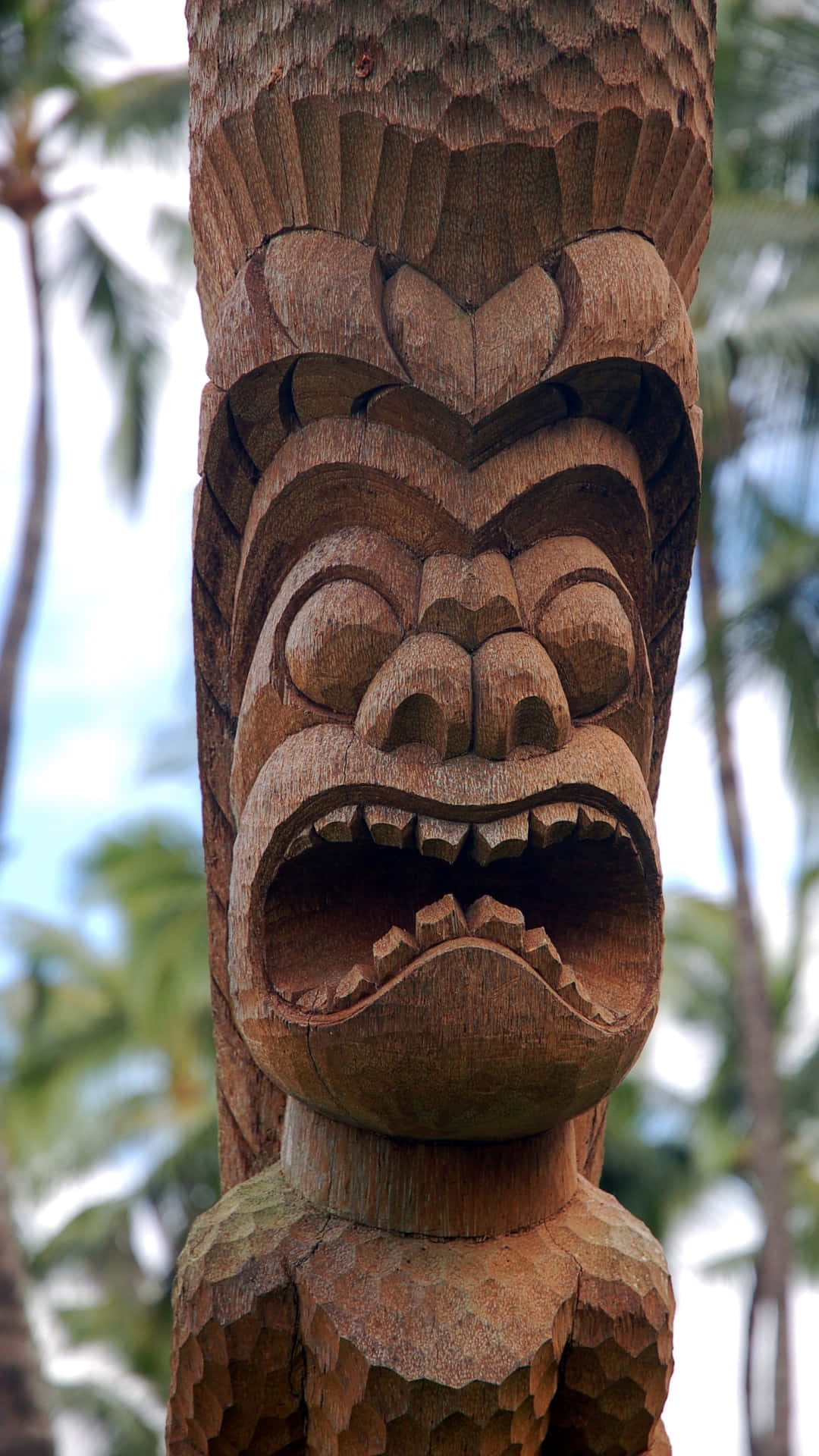 traditional tiki carving, wooden sculpture, fierce open-mouthed face, Full HD Phone Wallpaper