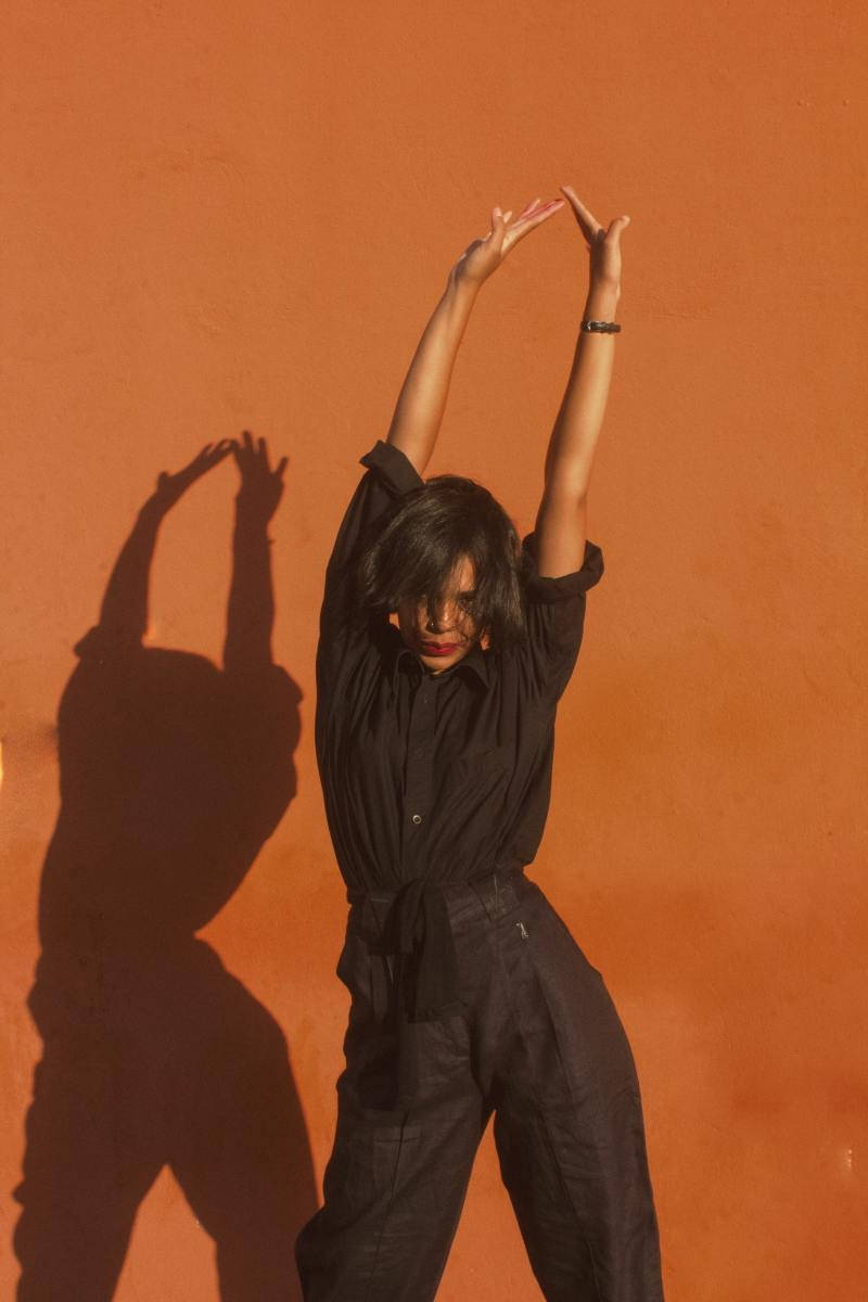 TikTok PFP, stretching girl, black clothing, SD Phone Wallpaper