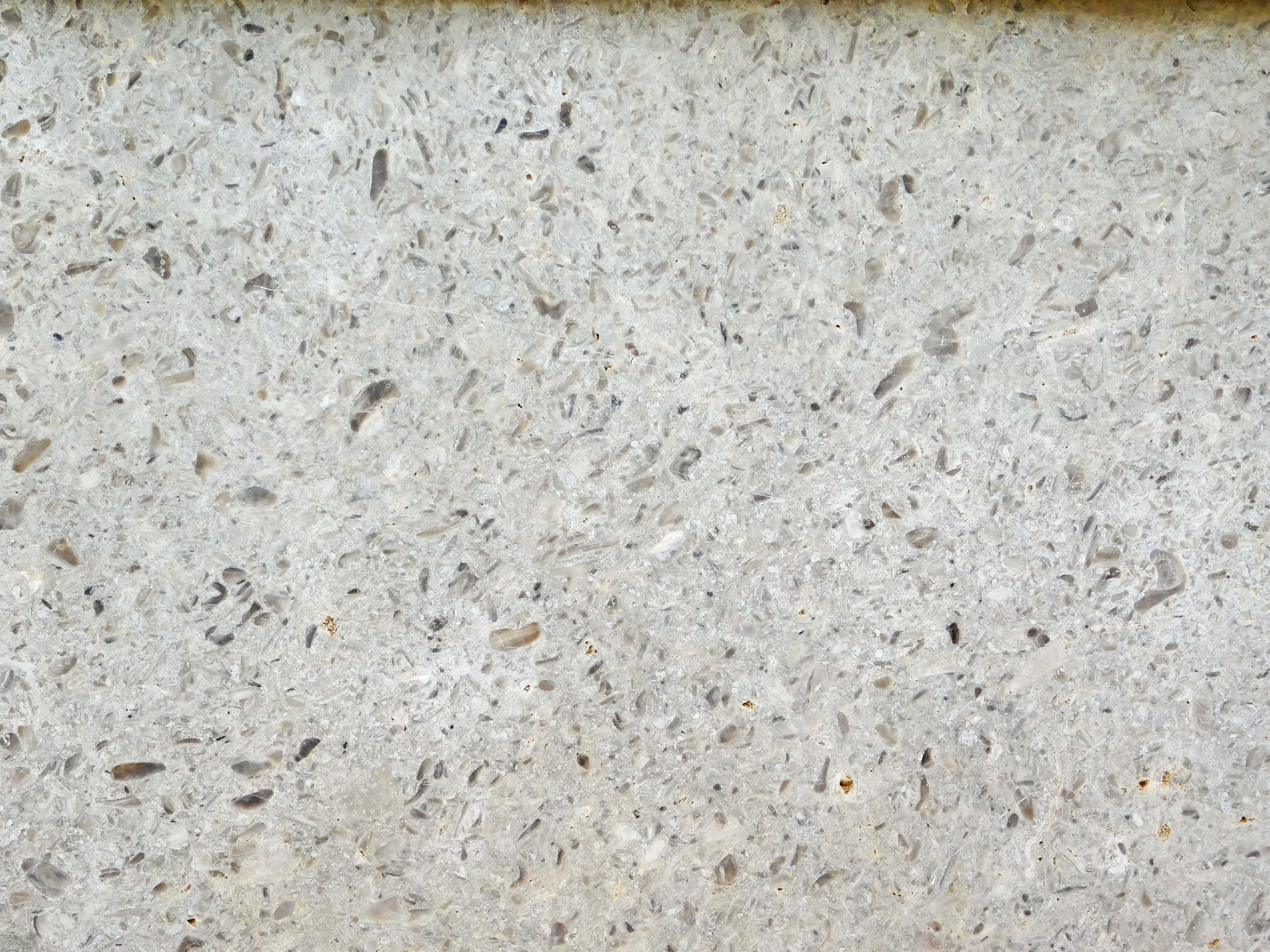 light gray speckled terrazzo surface, dark flecks, beige flecks, 4K Desktop Wallpaper
