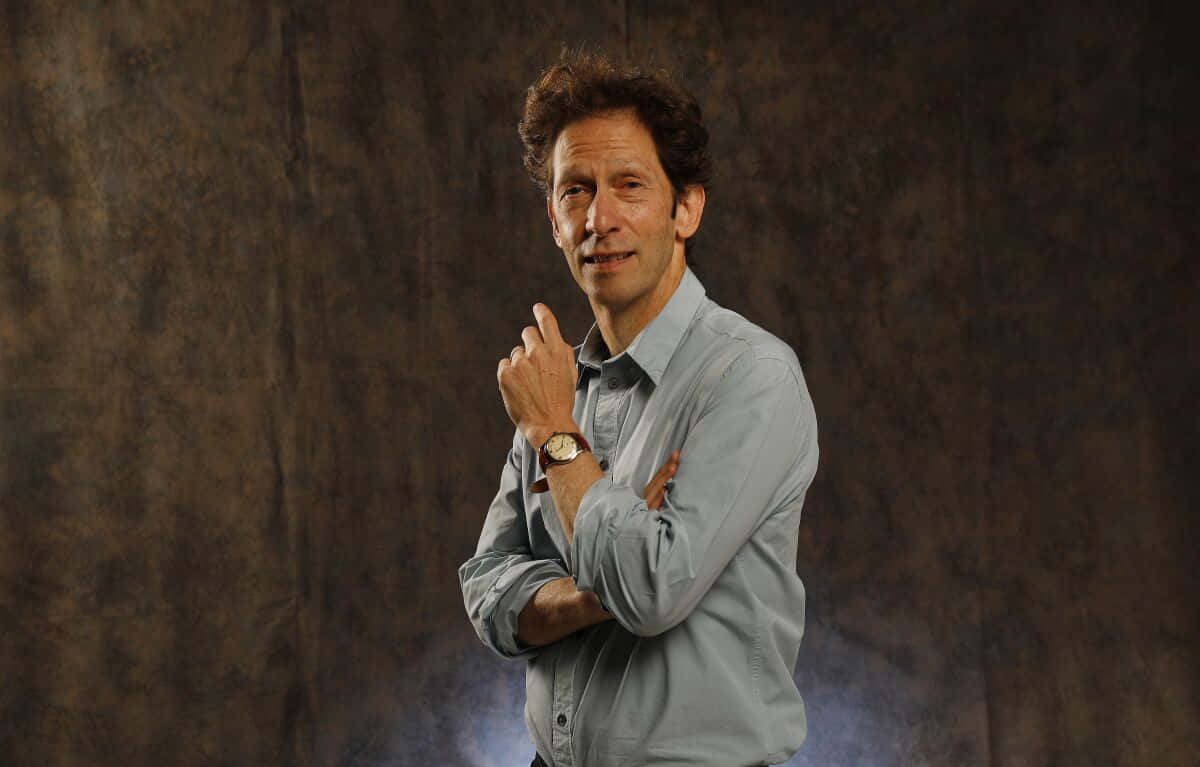Tim Blake Nelson, light blue shirt, textured brown backdrop, SD Desktop Wallpaper