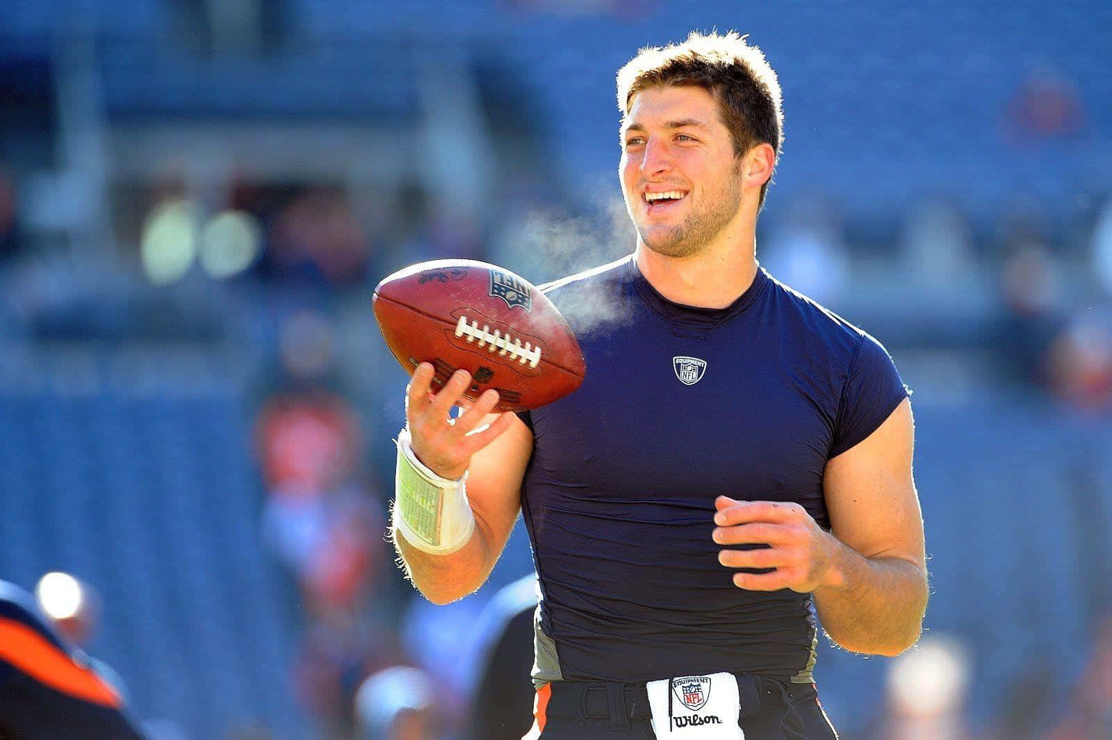 Tim Tebow, navy jersey, brown leather football, HD Desktop Wallpaper
