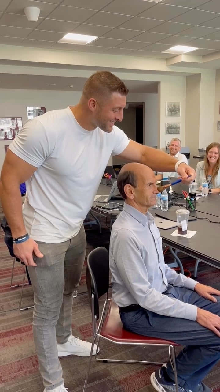 Tim Tebow, white tee, conference table, HD Phone Wallpaper