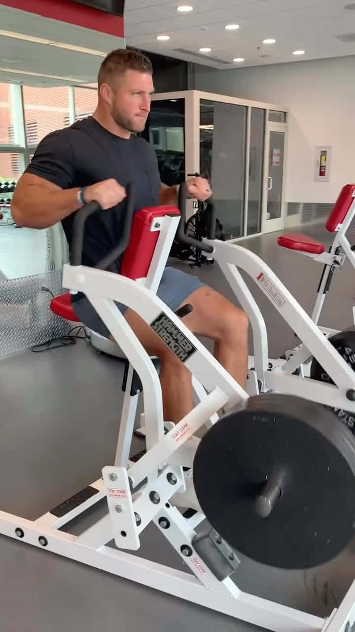 Tim Tebow, red and white cable machine, bright modern gym, HD Phone Wallpaper