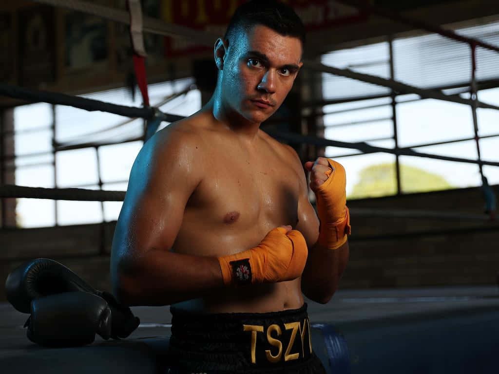 Tim Tszyu, orange hand wraps, dimly lit ring, SD Desktop Wallpaper