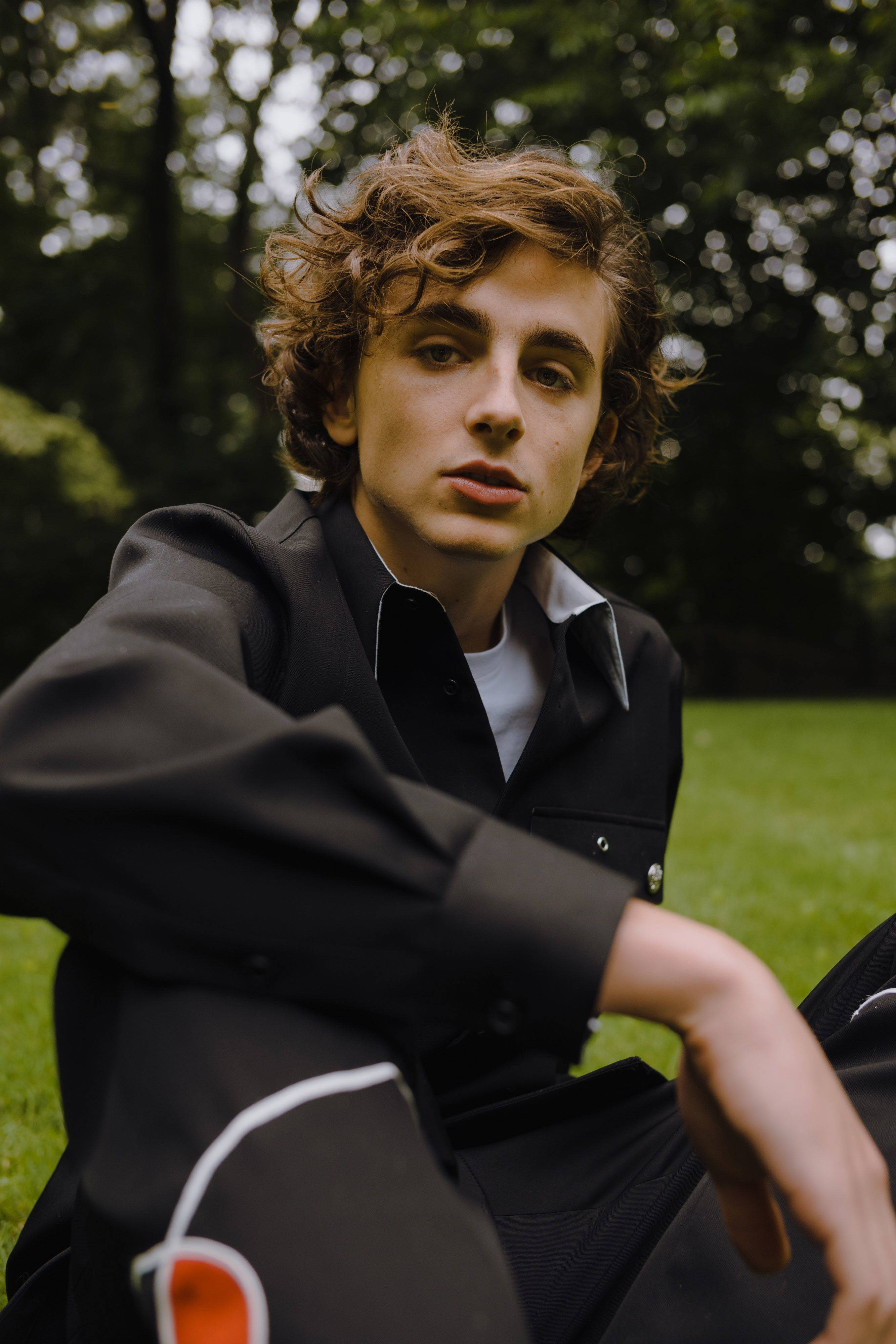 Timothée Chalamet, curly brown hair, black jacket, 4K Phone Wallpaper