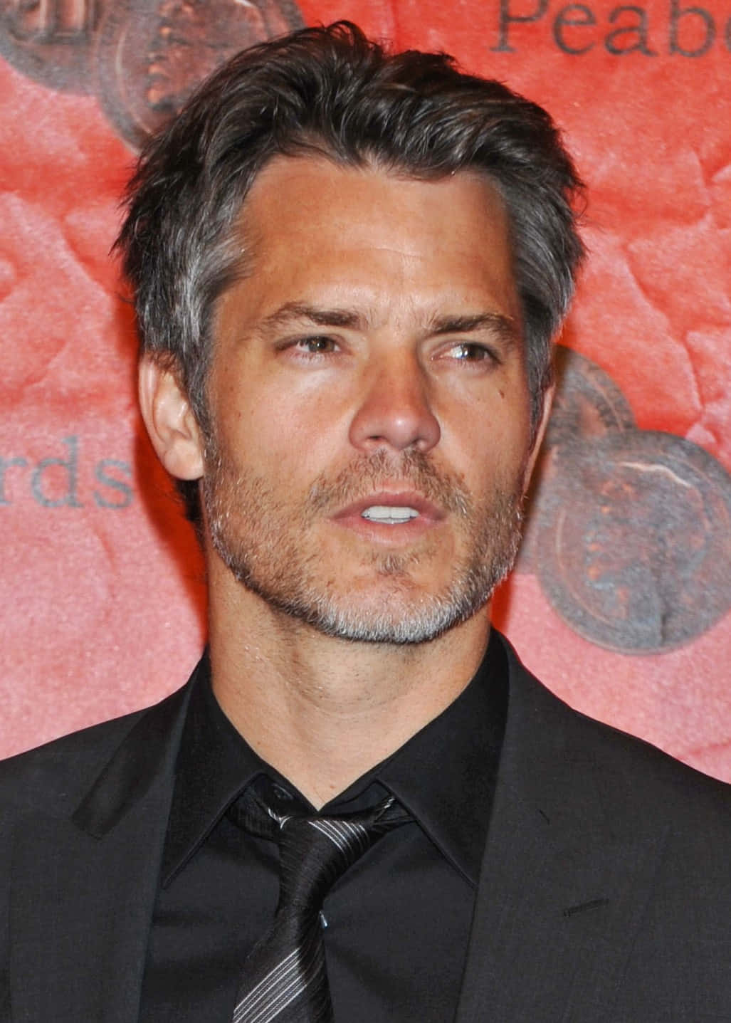 Timothy Olyphant, black suit and tie, red textured backdrop, HD Phone Wallpaper