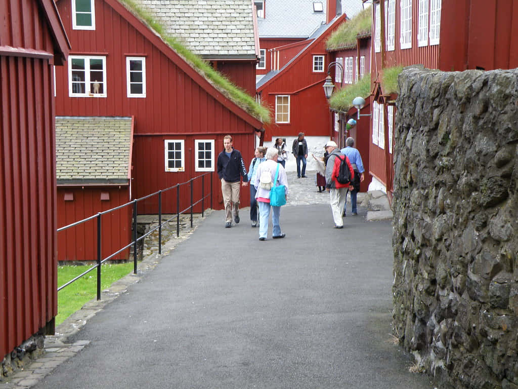 Tinganes, narrow paved path, vibrant red wooden buildings, SD Desktop Wallpaper