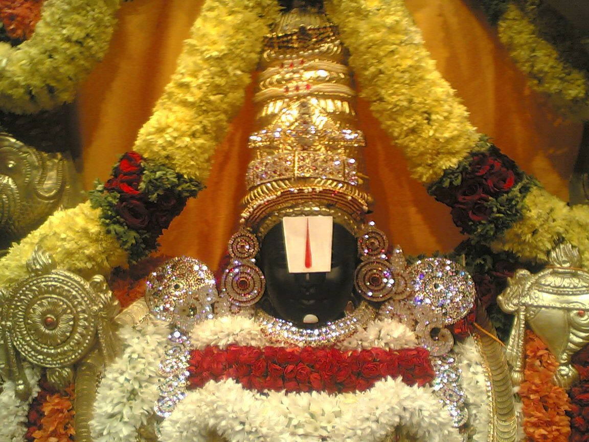 Tirupati Balaji, golden ornaments, vibrant yellow red and white floral garlands, SD Desktop Wallpaper