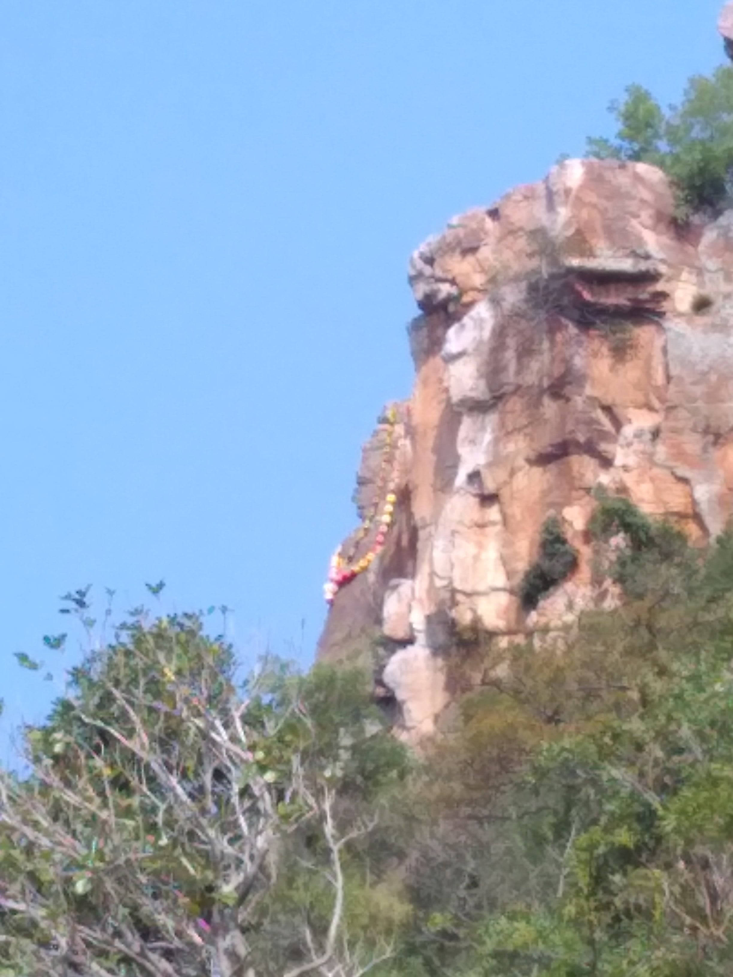Tirupati Balaji, rock formation, colorful prayer flags, 2K Phone Wallpaper