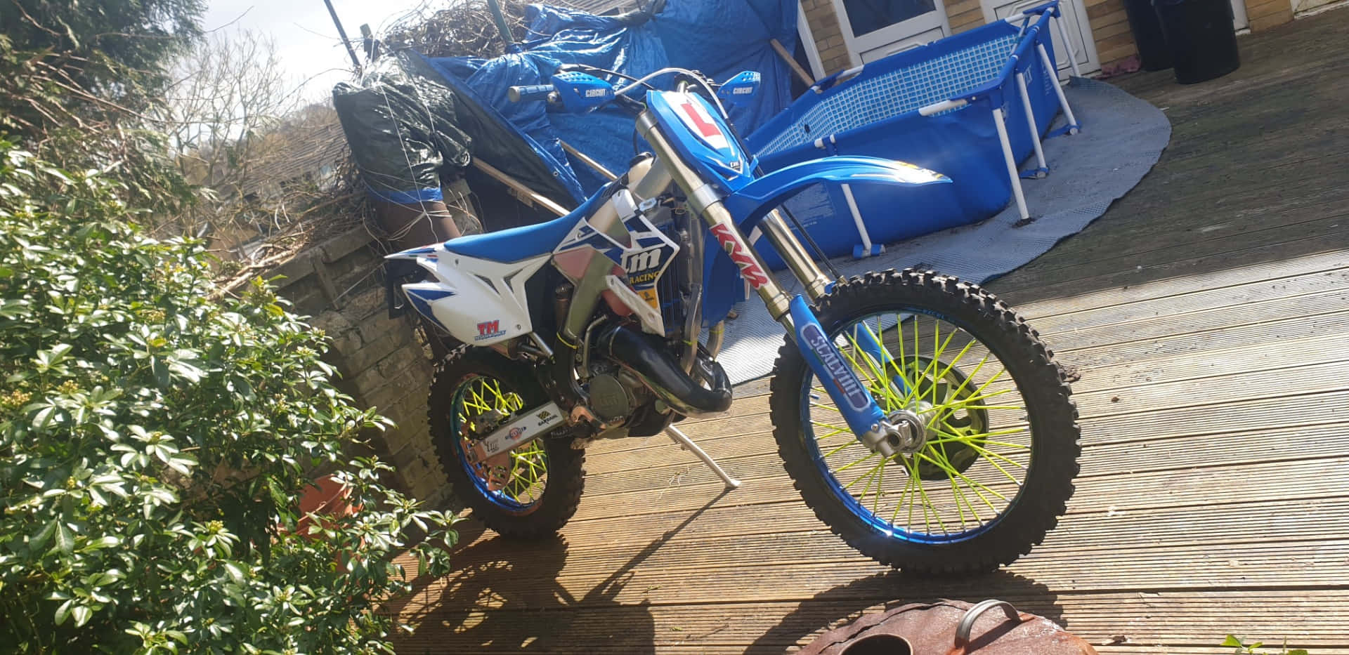 TM Racing, blue and white dirt bike, neon yellow wheels, Full HD Desktop Wallpaper