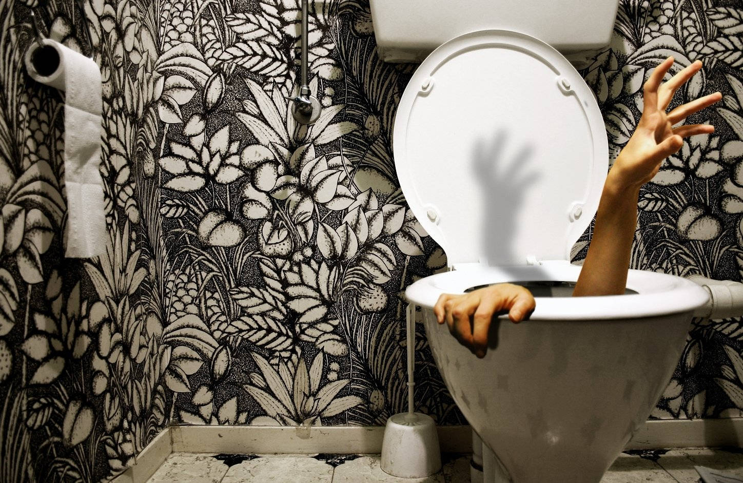 white toilet bowl, black and white floral wallpapered bathroom wall, person's arms and hands, HD Desktop Wallpaper