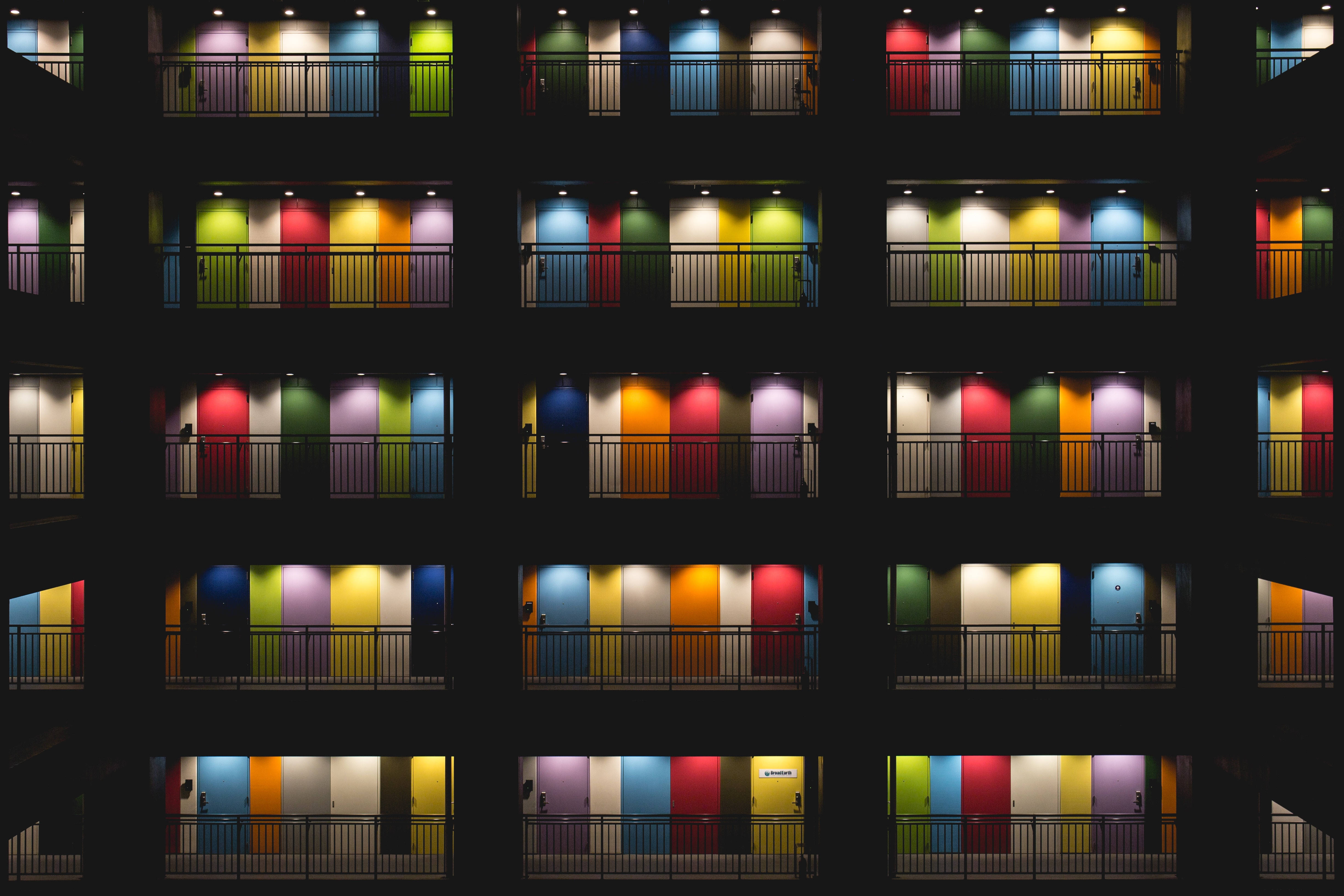 Tokyo, multi-story apartment building, brightly colored doors, 4K Desktop Wallpaper