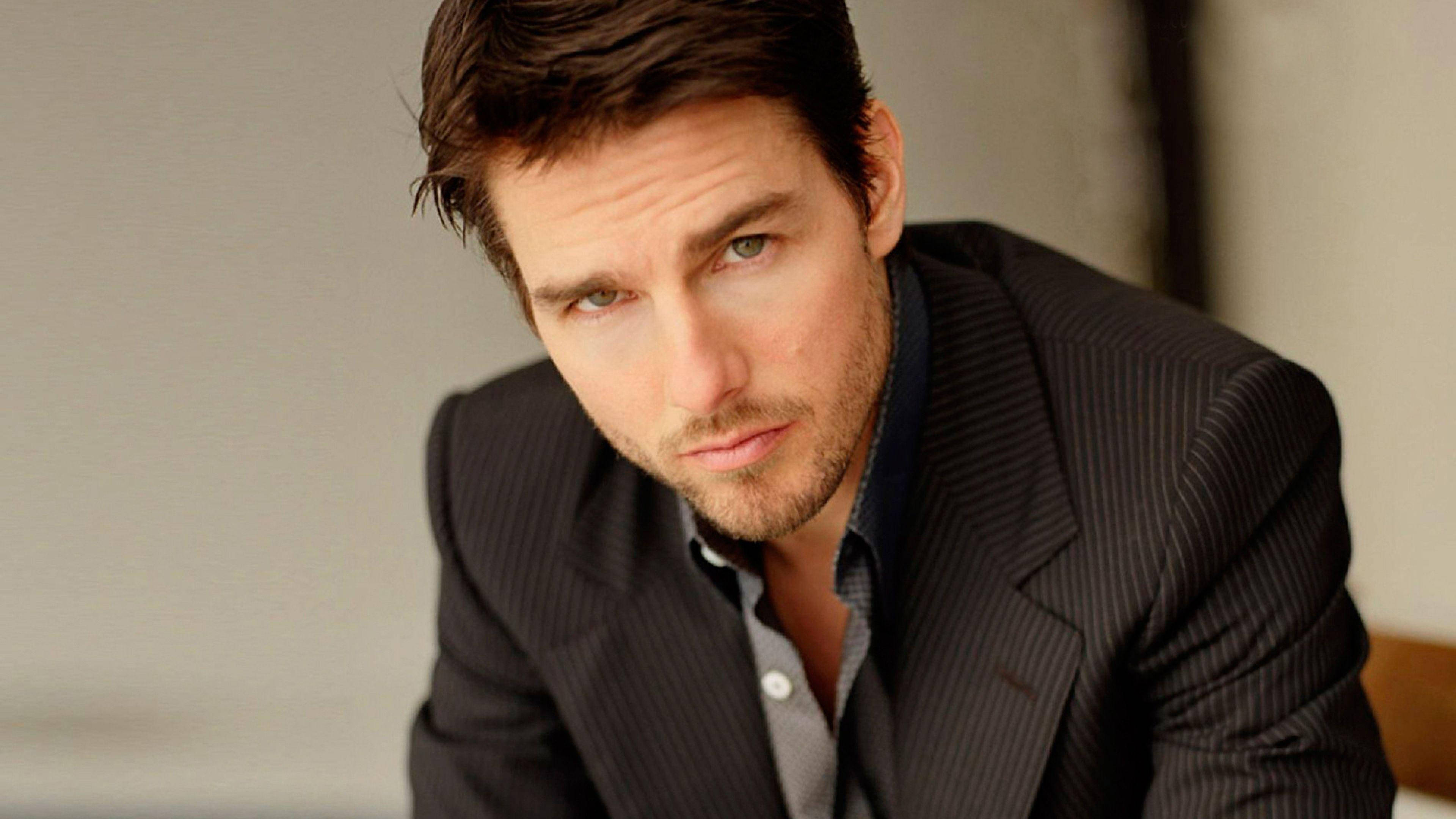 Tom Cruise, dark pinstripe suit, serious gaze, 4K Desktop Wallpaper