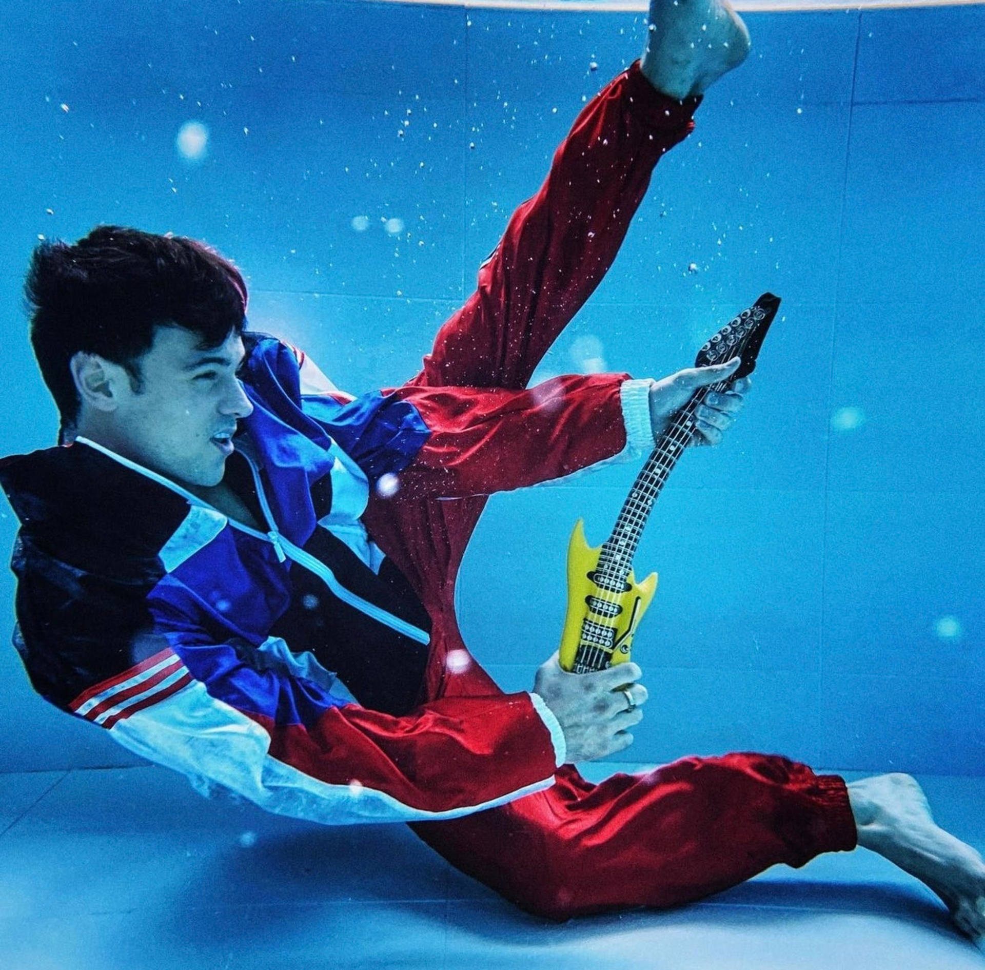 Tom Daley, red blue tracksuit, yellow electric guitar, Full HD Desktop Wallpaper