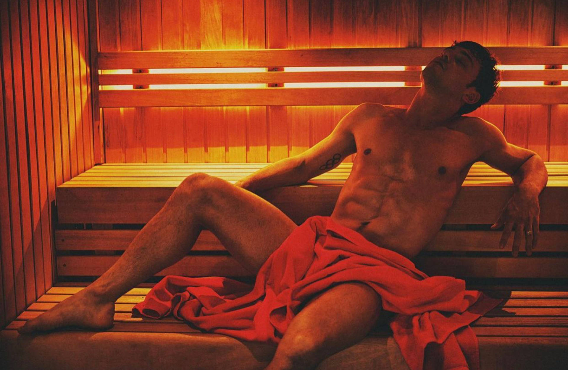 Tom Daley, wooden sauna, glowing orange lights, Full HD Desktop Wallpaper