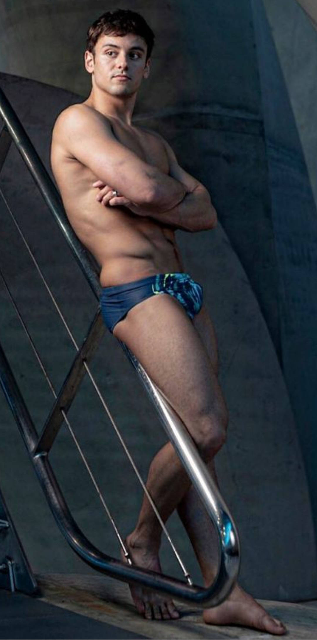 Tom Daley, blue swim trunks, metallic railing, Full HD Phone Wallpaper