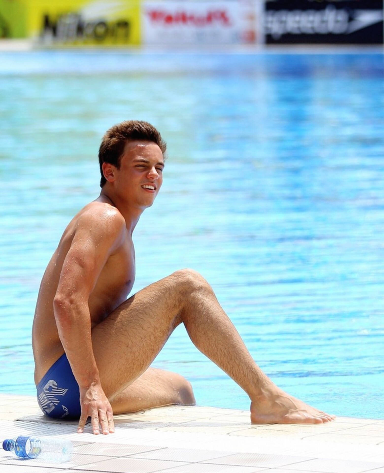 Tom Daley, blue swim trunks, bright blue swimming pool, Full HD Phone Wallpaper