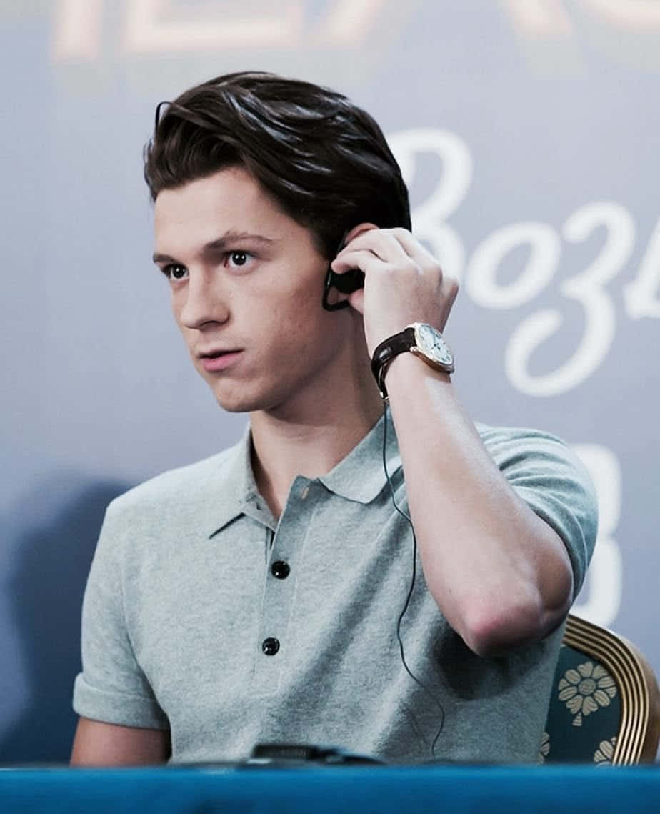 Tom Holland, black earphones, light gray polo shirt, SD Phone Wallpaper