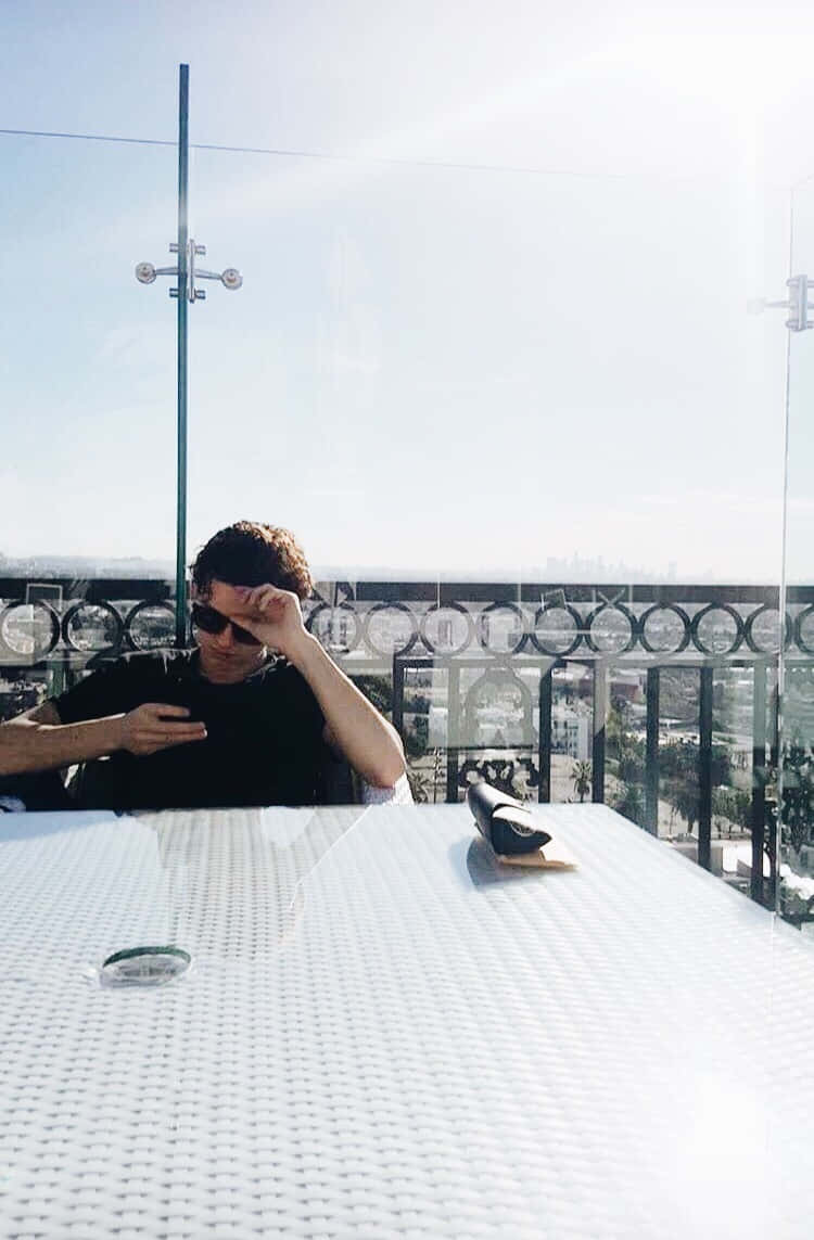 Tom Holland Aesthetic, sunglasses, white outdoor table, SD Phone Wallpaper