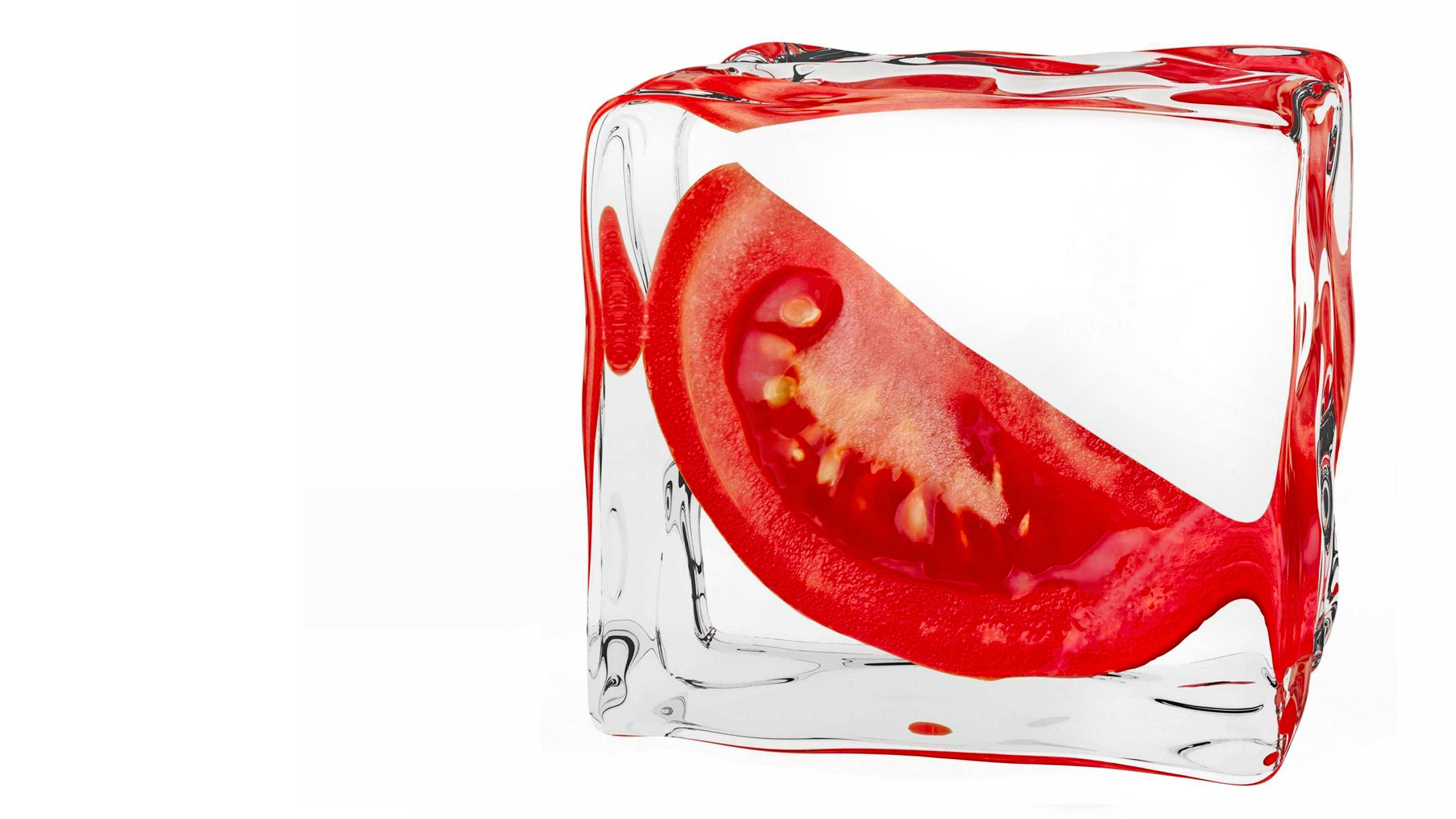 sliced red tomato fruit ice cube, juicy slice of fresh tomato, vibrant red tomato slice, 2K Desktop Wallpaper