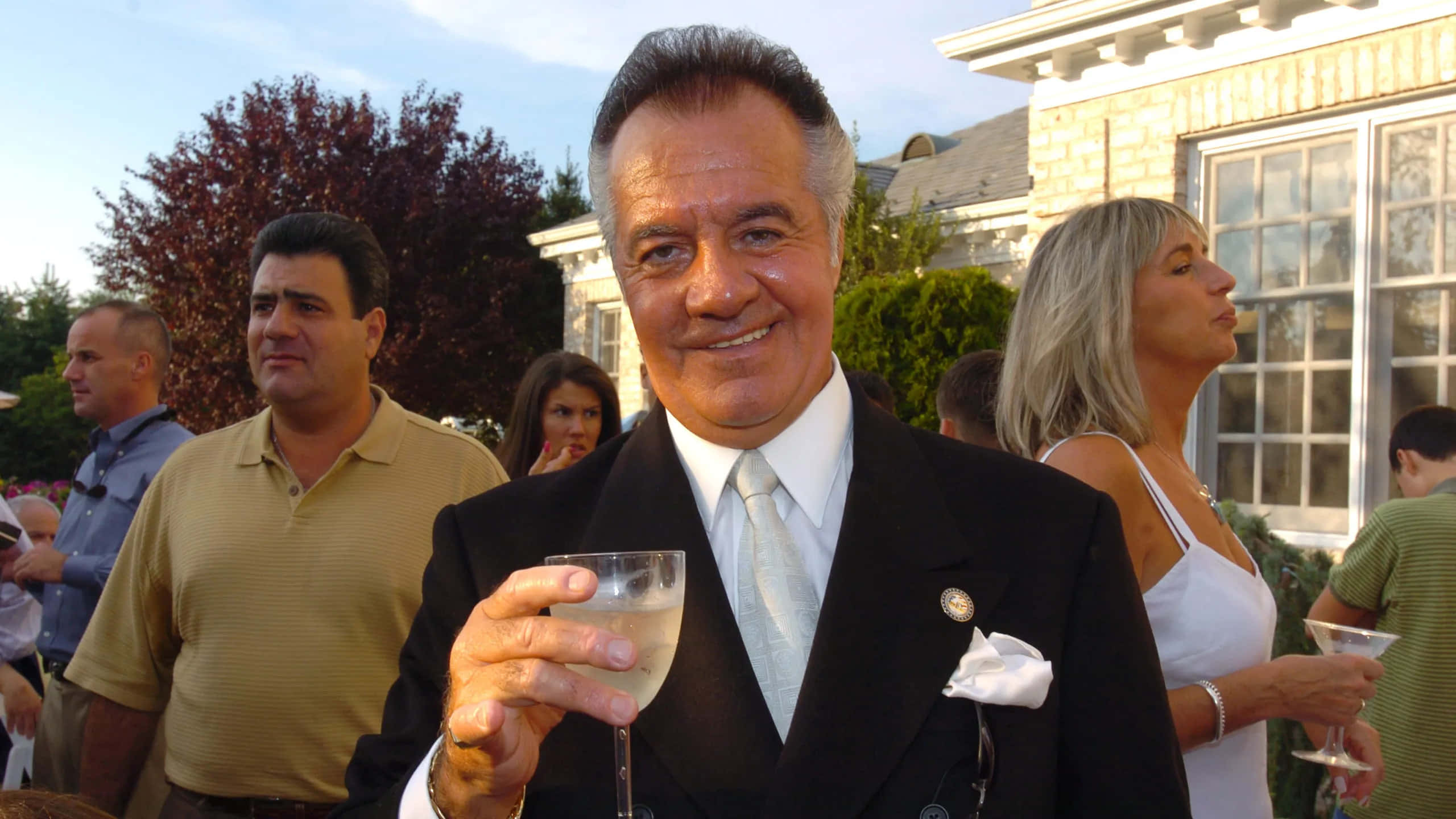 Tony Sirico, black suit, glass of champagne, 2K Desktop Wallpaper