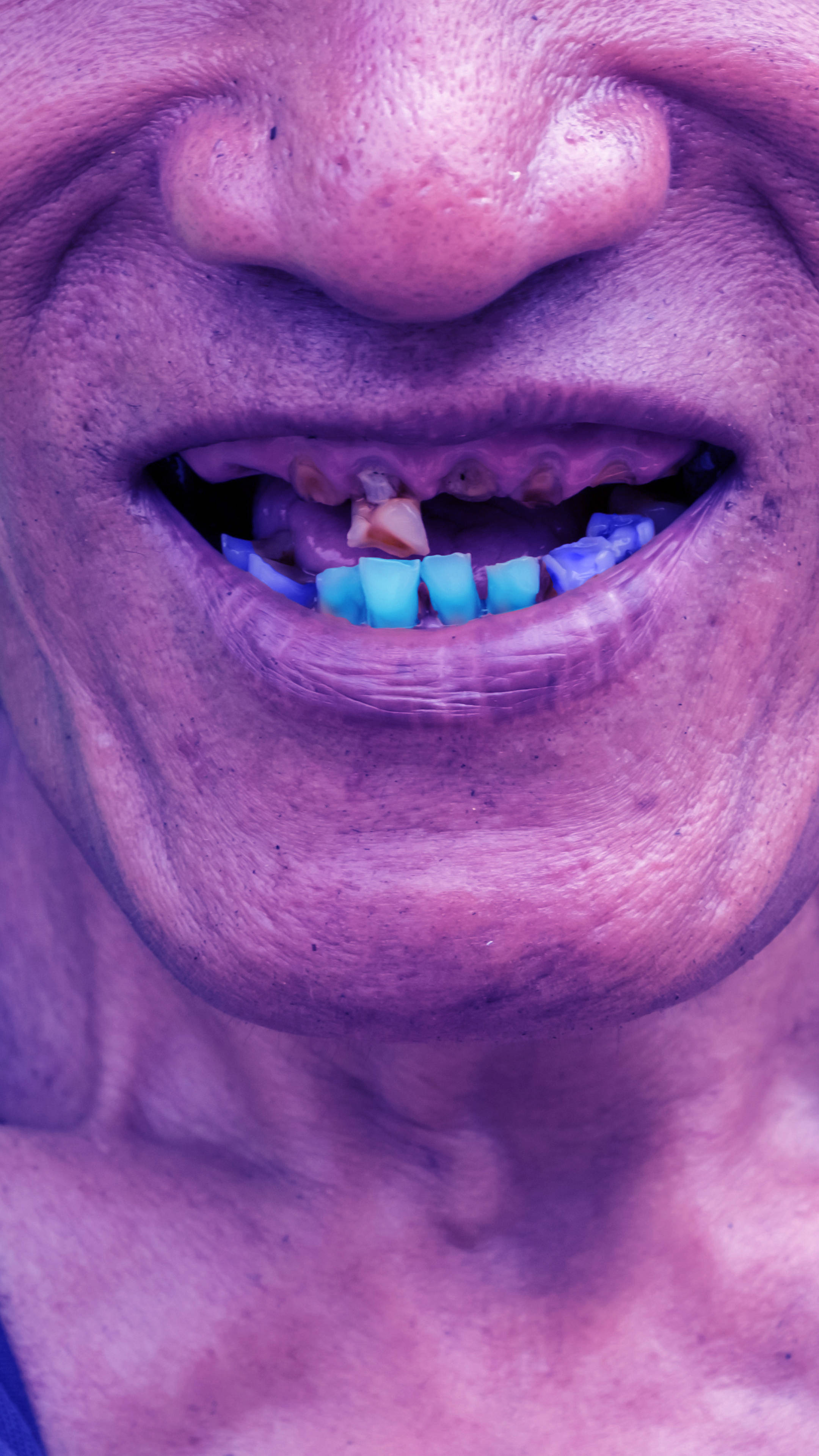 ugly blue teeth, elderly person, purple light, 4K Phone Wallpaper