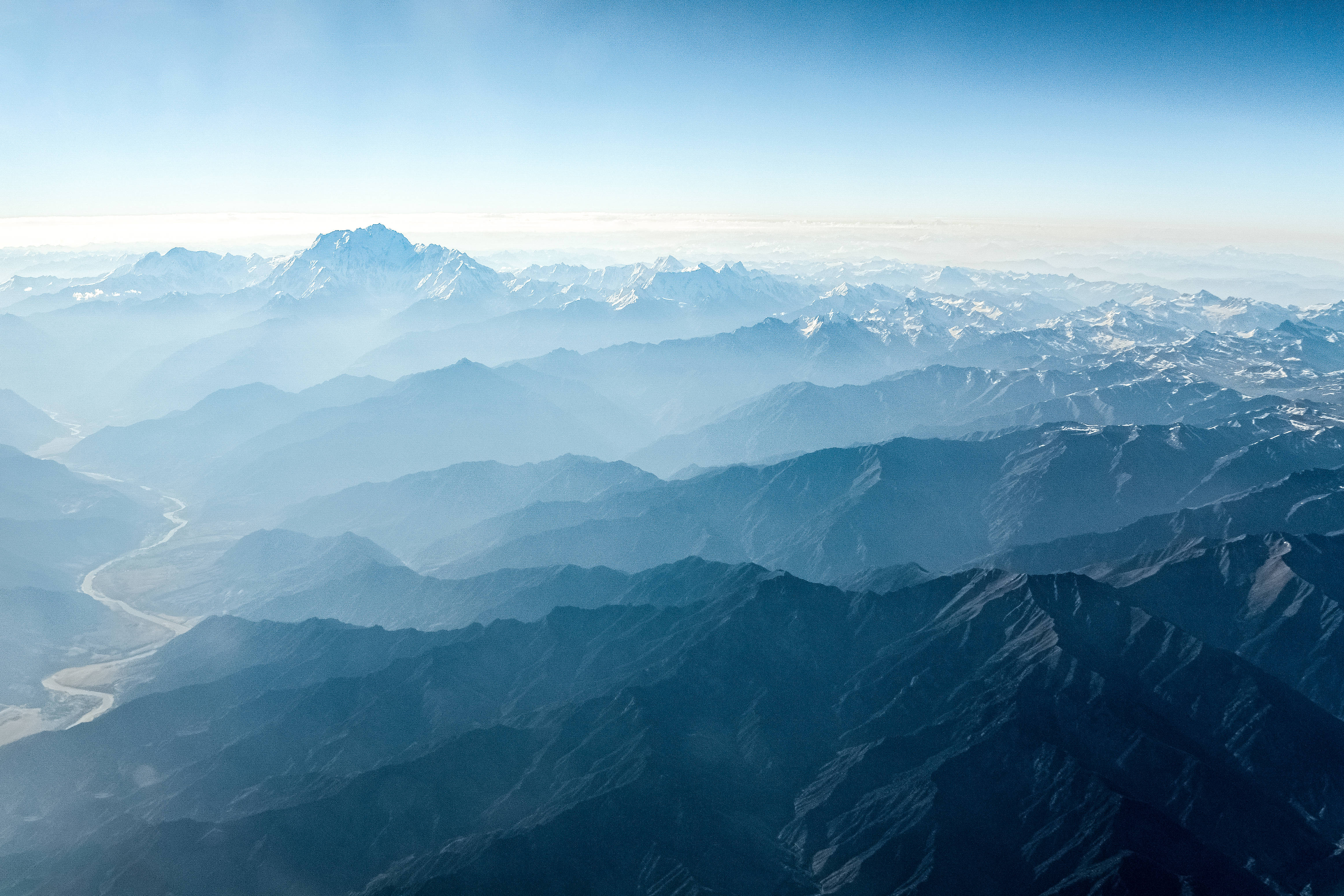 Mountainous Broken Topography, layered mountain ranges, atmospheric haze, 4K Desktop Wallpaper