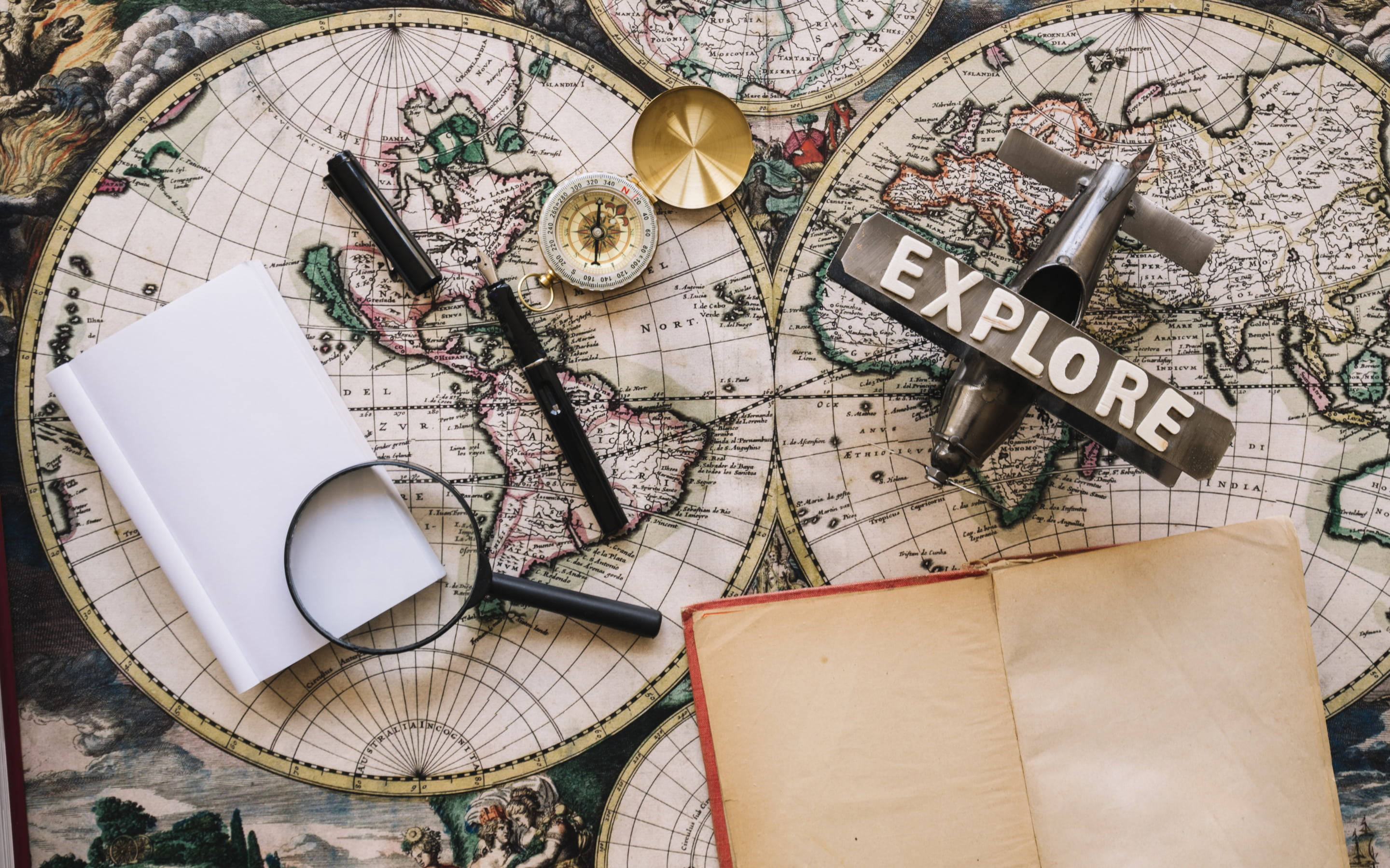 vintage explorer's gear, model airplane compass, magnifying glass, 2K Desktop Wallpaper