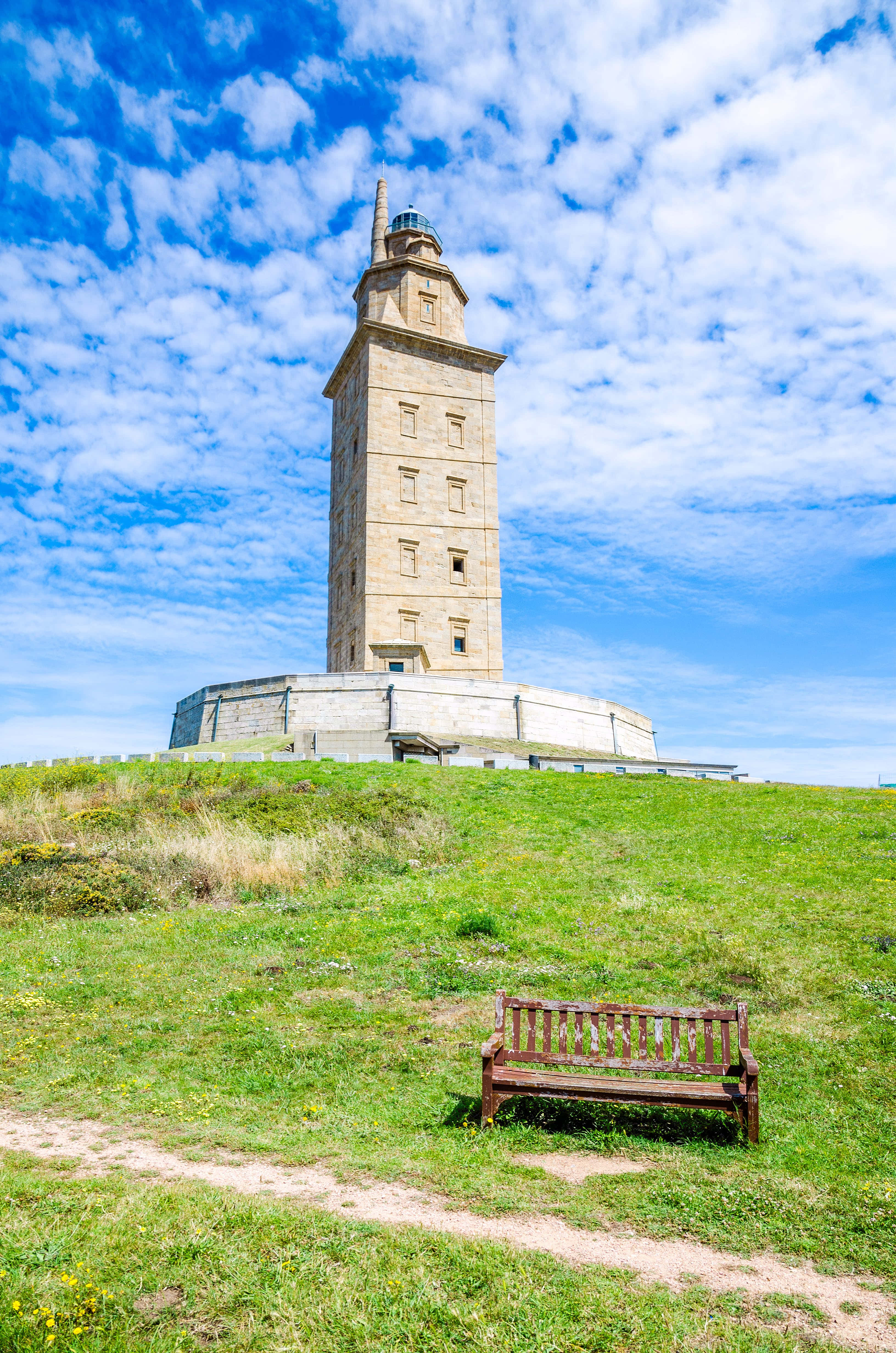 Tower Of Hercules, stone lighthouse, grassy hill, 4K Phone Wallpaper