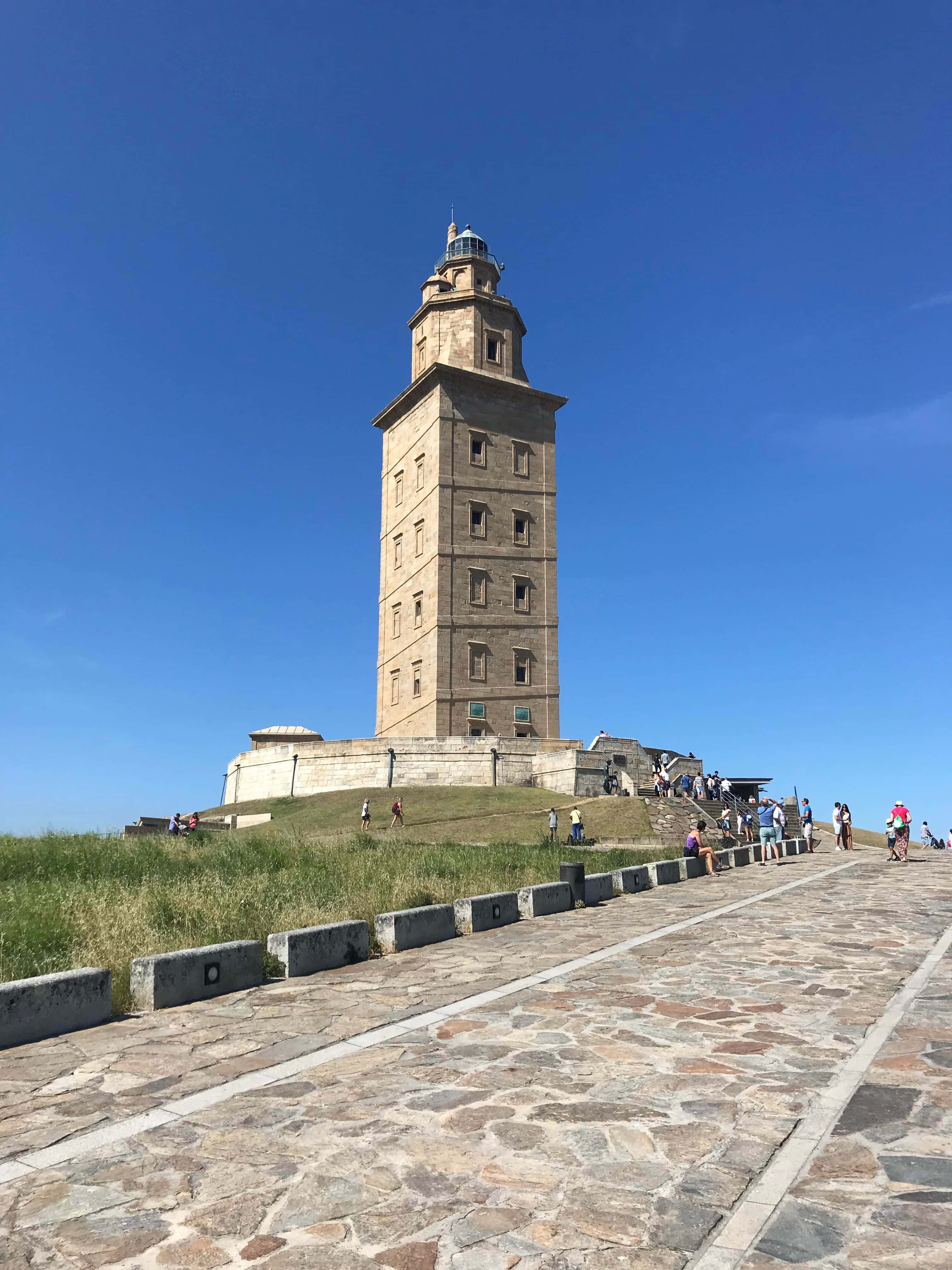 Tower Of Hercules, stone lighthouse, grassy hill, 4K Phone Wallpaper