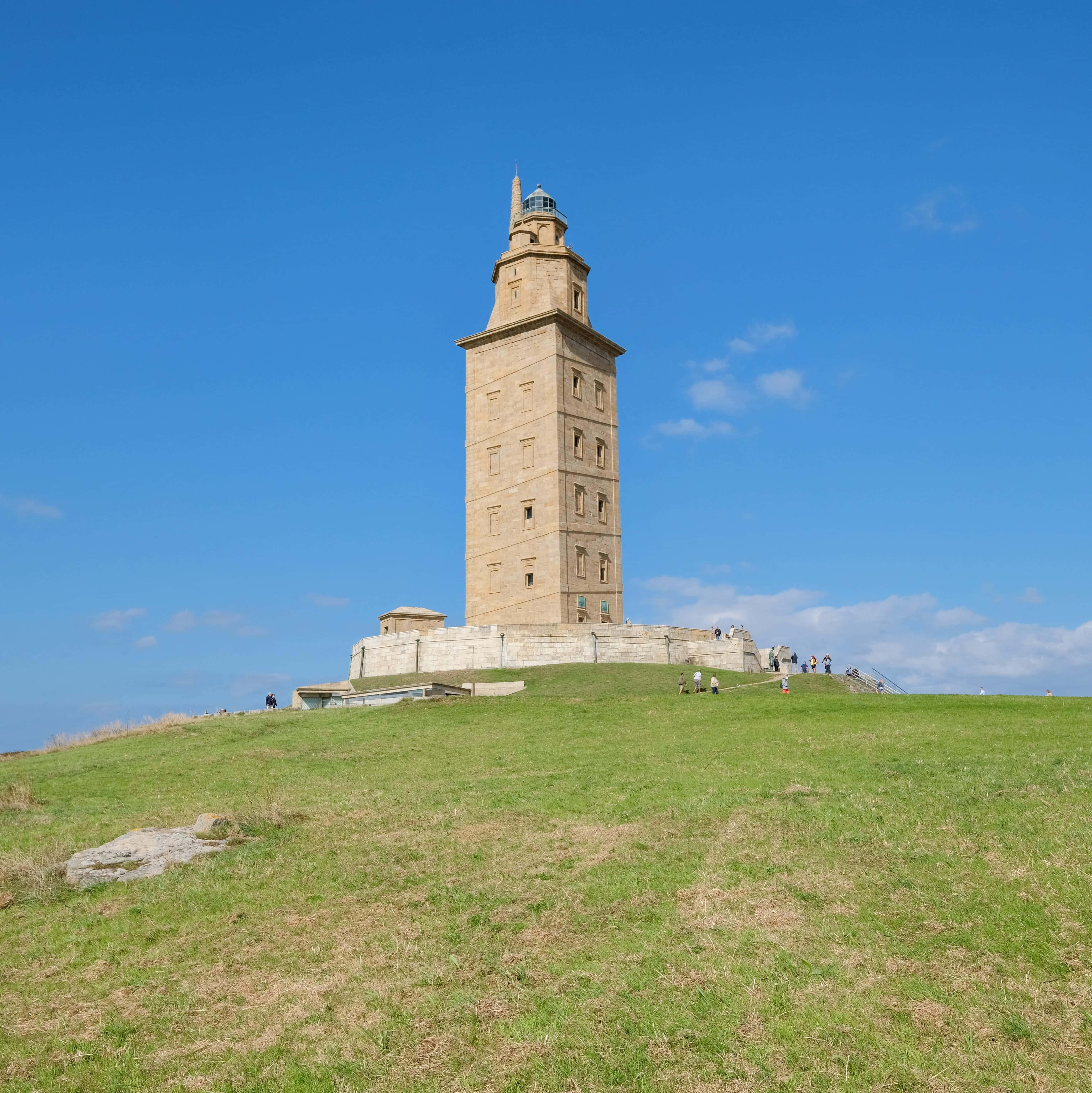 Tower Of Hercules, stone lighthouse, grassy hill, 4K Phone Wallpaper