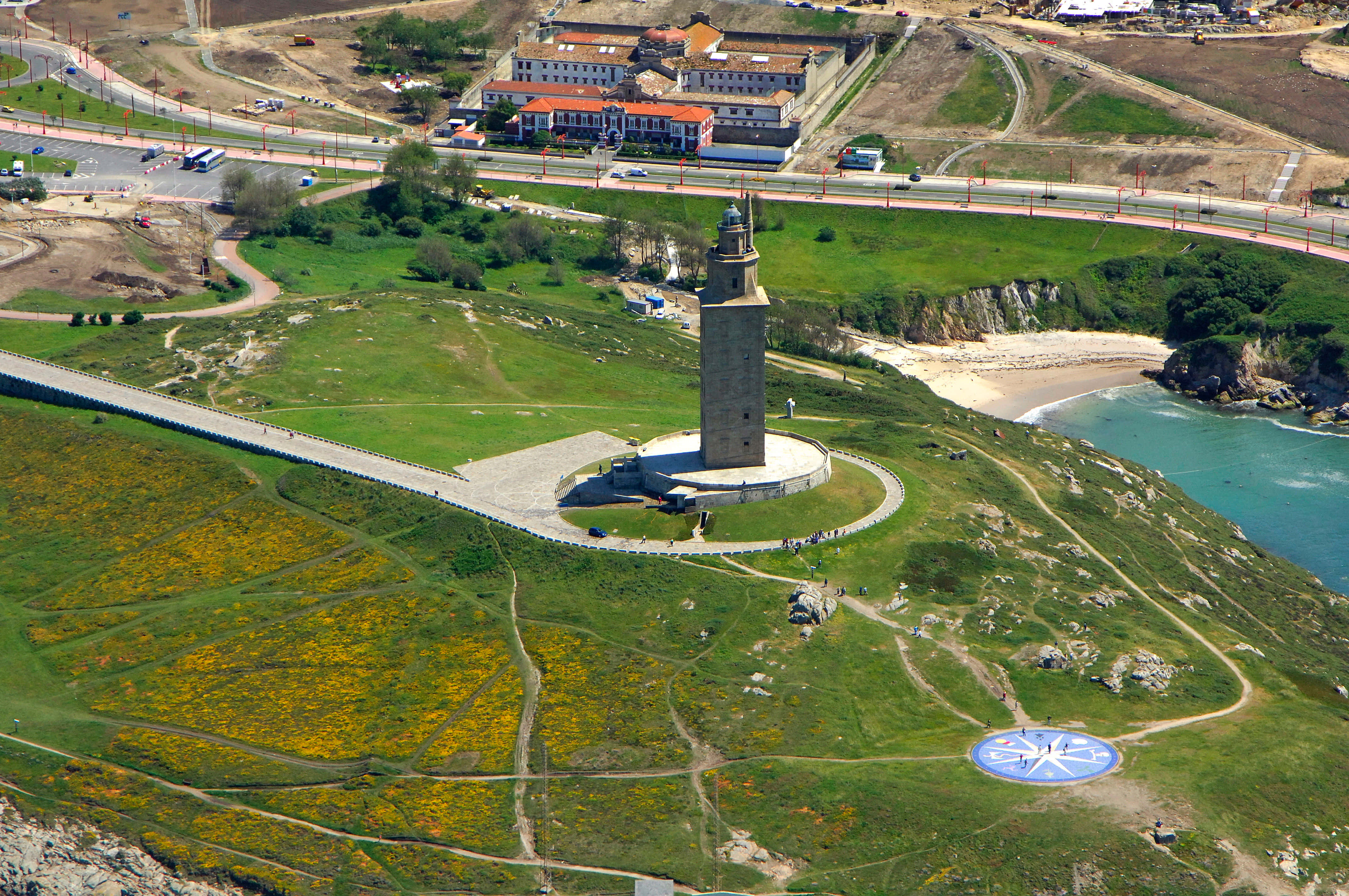 Tower Of Hercules, grassy cliff, turquoise sea, 4K Desktop Wallpaper