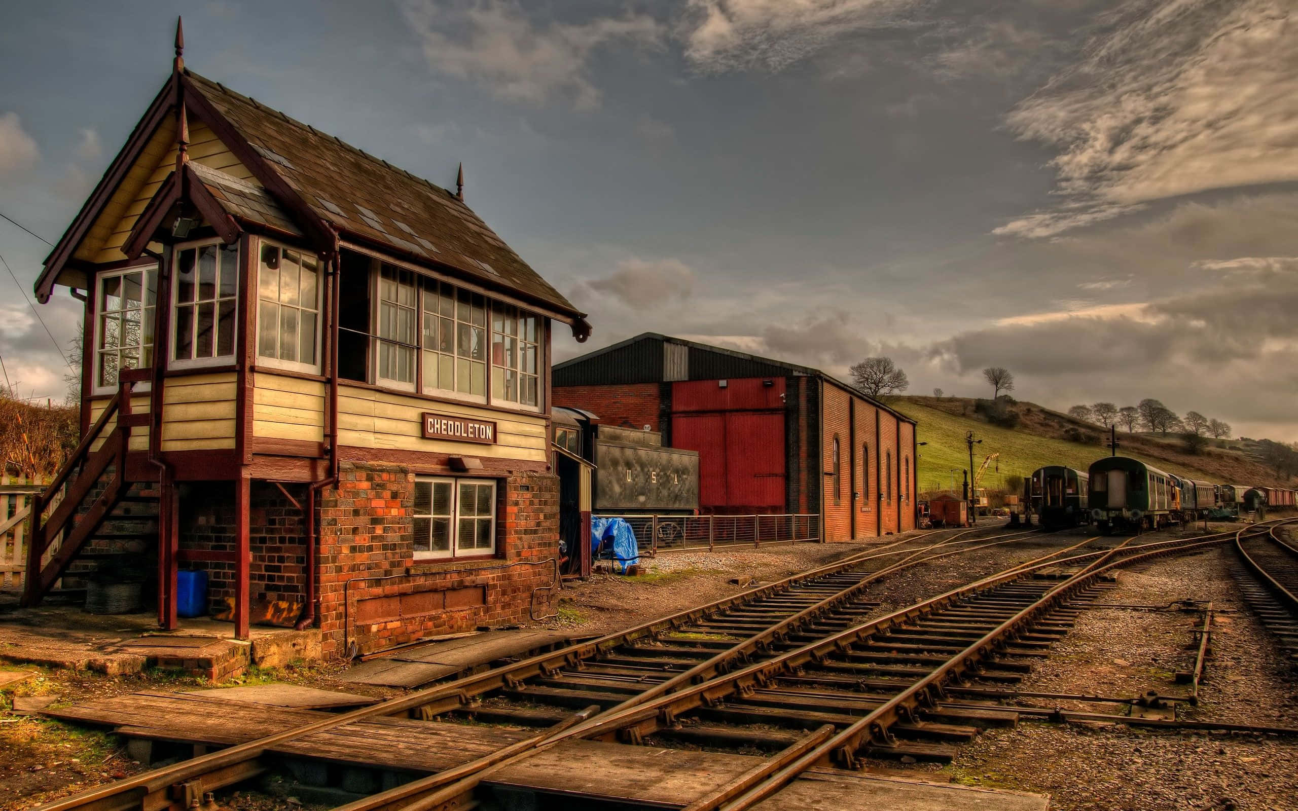 vintage railway station, wooden and brick architecture, rusted tracks, 2K Desktop Wallpaper