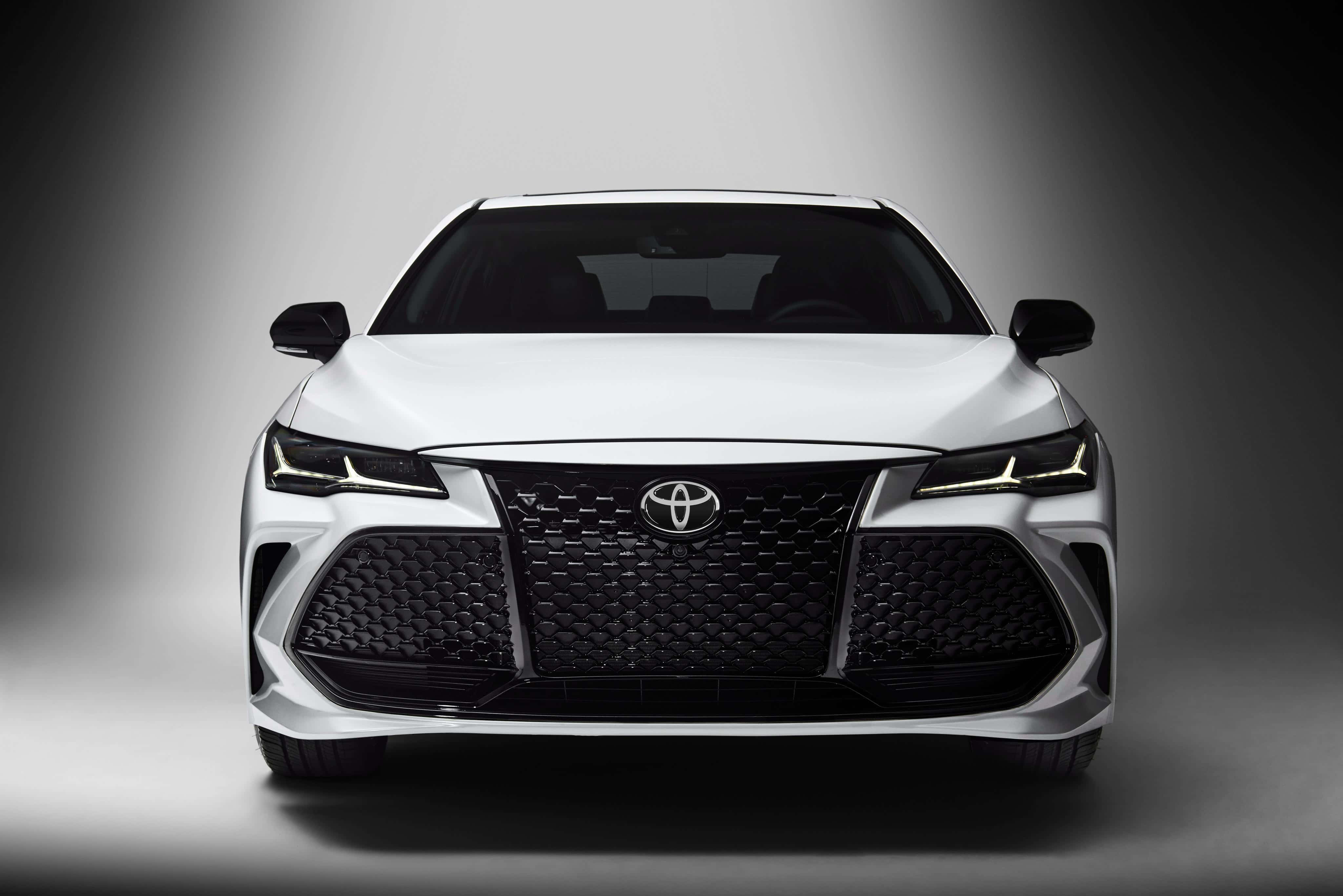 Toyota Avalon, sleek white Toyota sedan, dramatic studio lighting, 4K Desktop Wallpaper