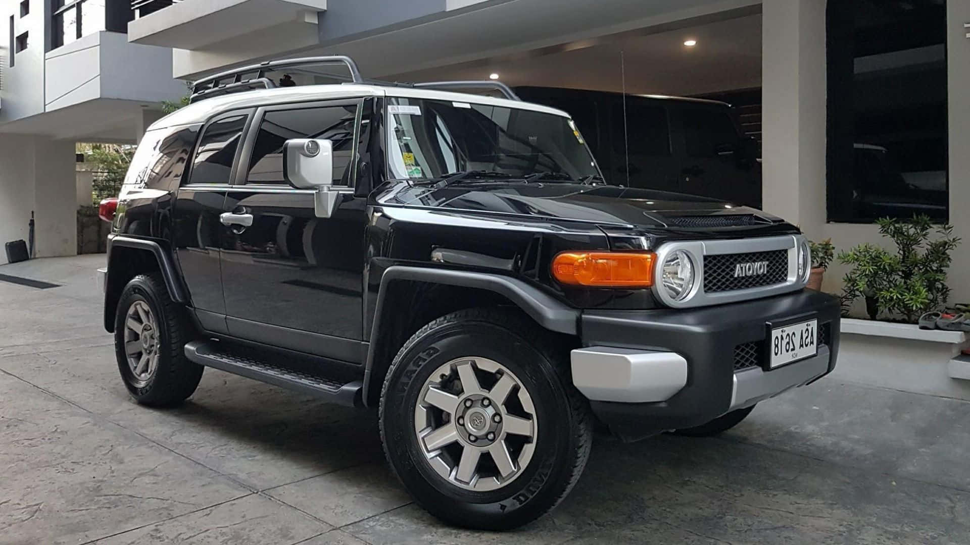 Toyota FJ Cruiser, sleek black, tiled driveway, Full HD Desktop Wallpaper