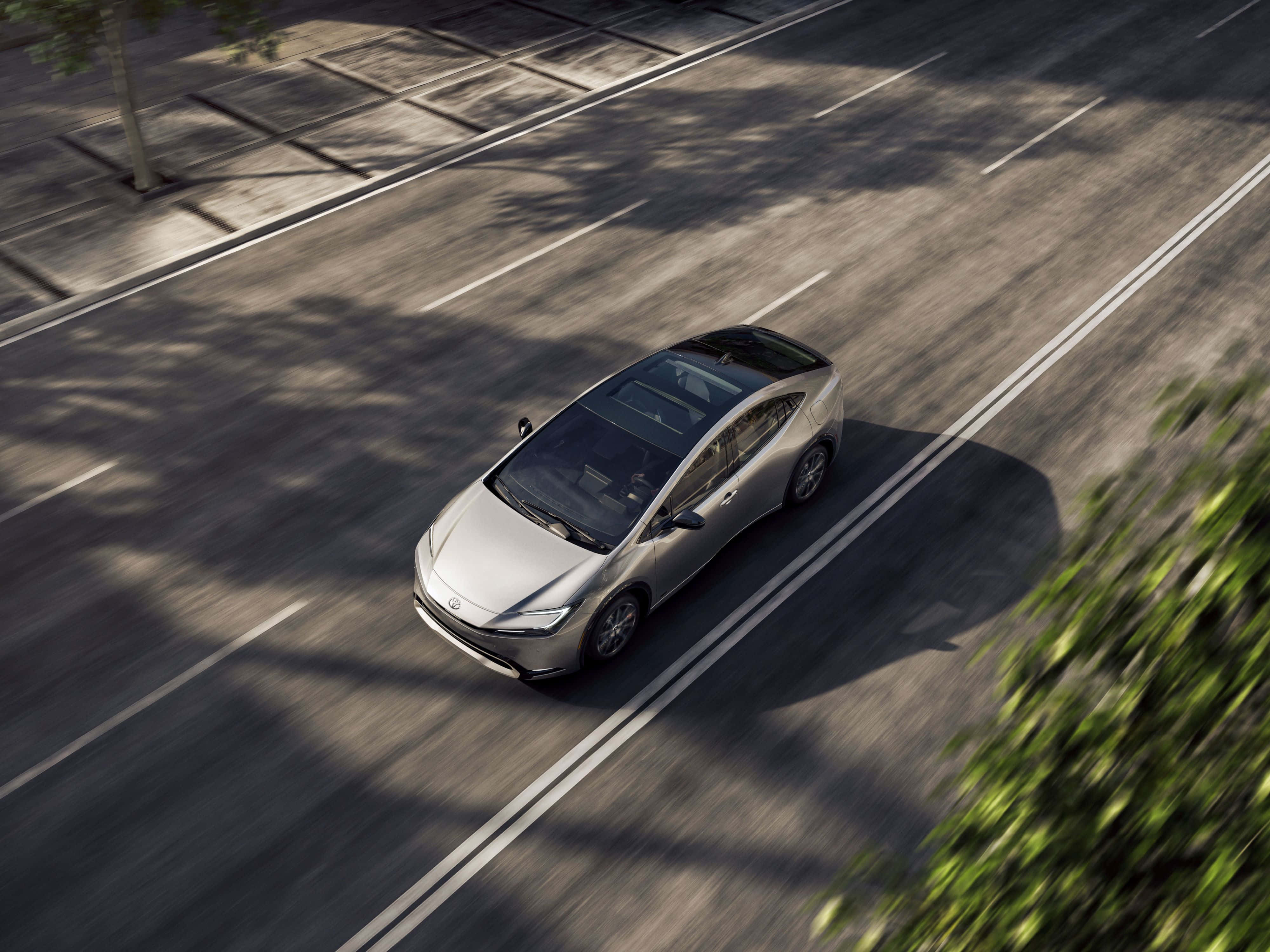 Silver Toyota Prius, aerial view, tree-lined street, 4K Desktop Wallpaper