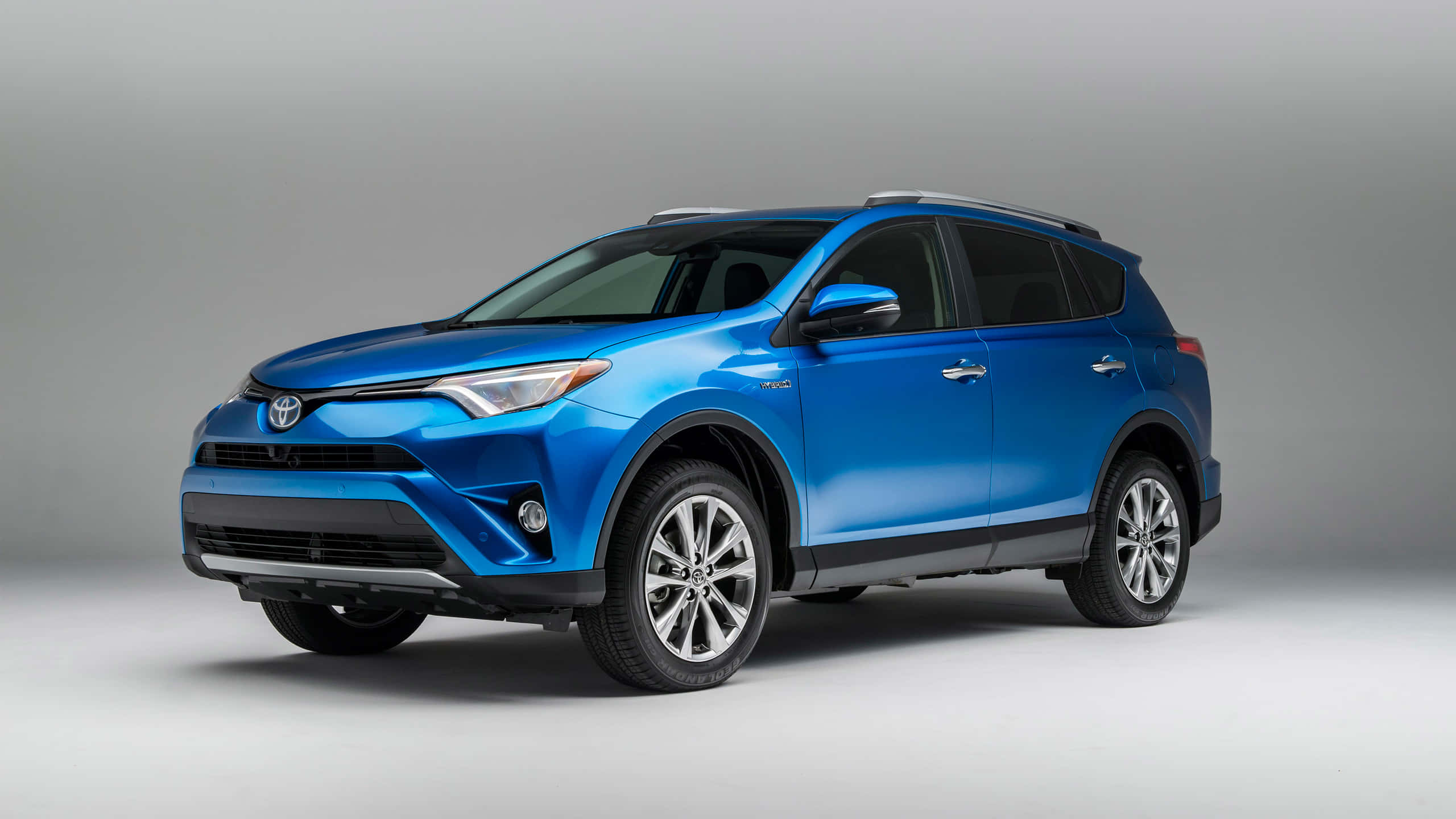 2022 Toyota RAV4, vibrant blue, sleek modern design, 2K Desktop Wallpaper