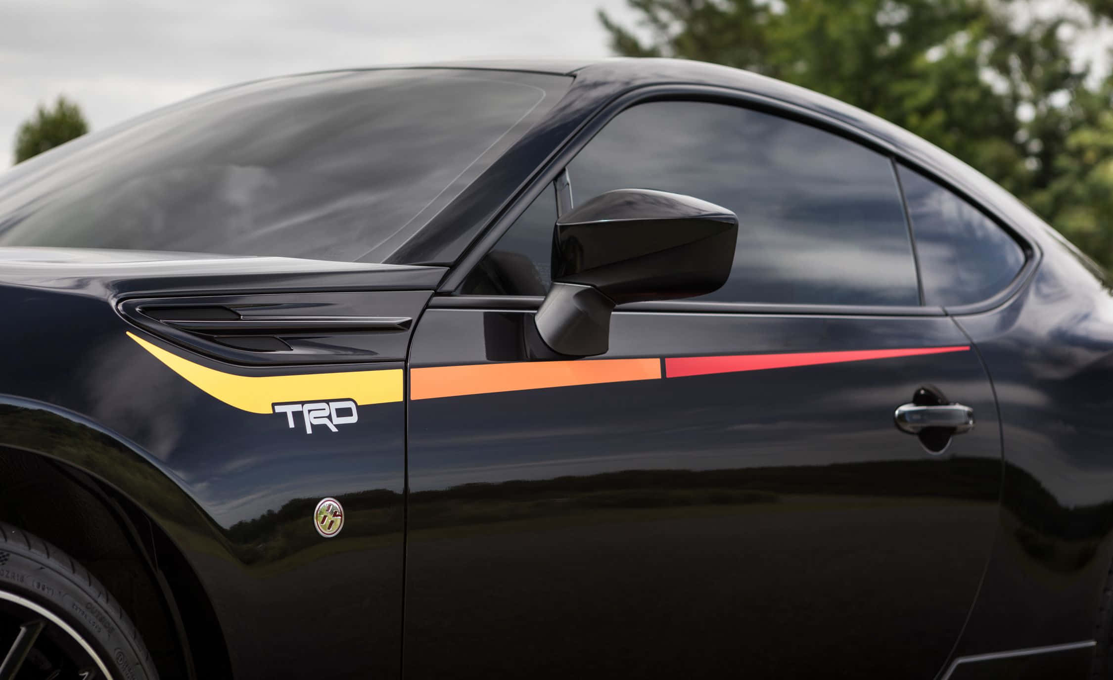 Toyota TRD, black sports car, vibrant yellow orange and red TRD stripe accents, Full HD Desktop Wallpaper
