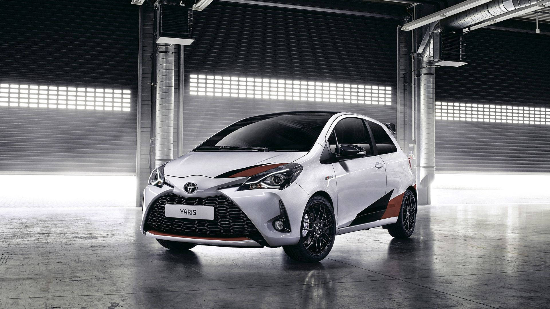 White Toyota Yaris, orange accents, modern industrial garage, Full HD Desktop Wallpaper