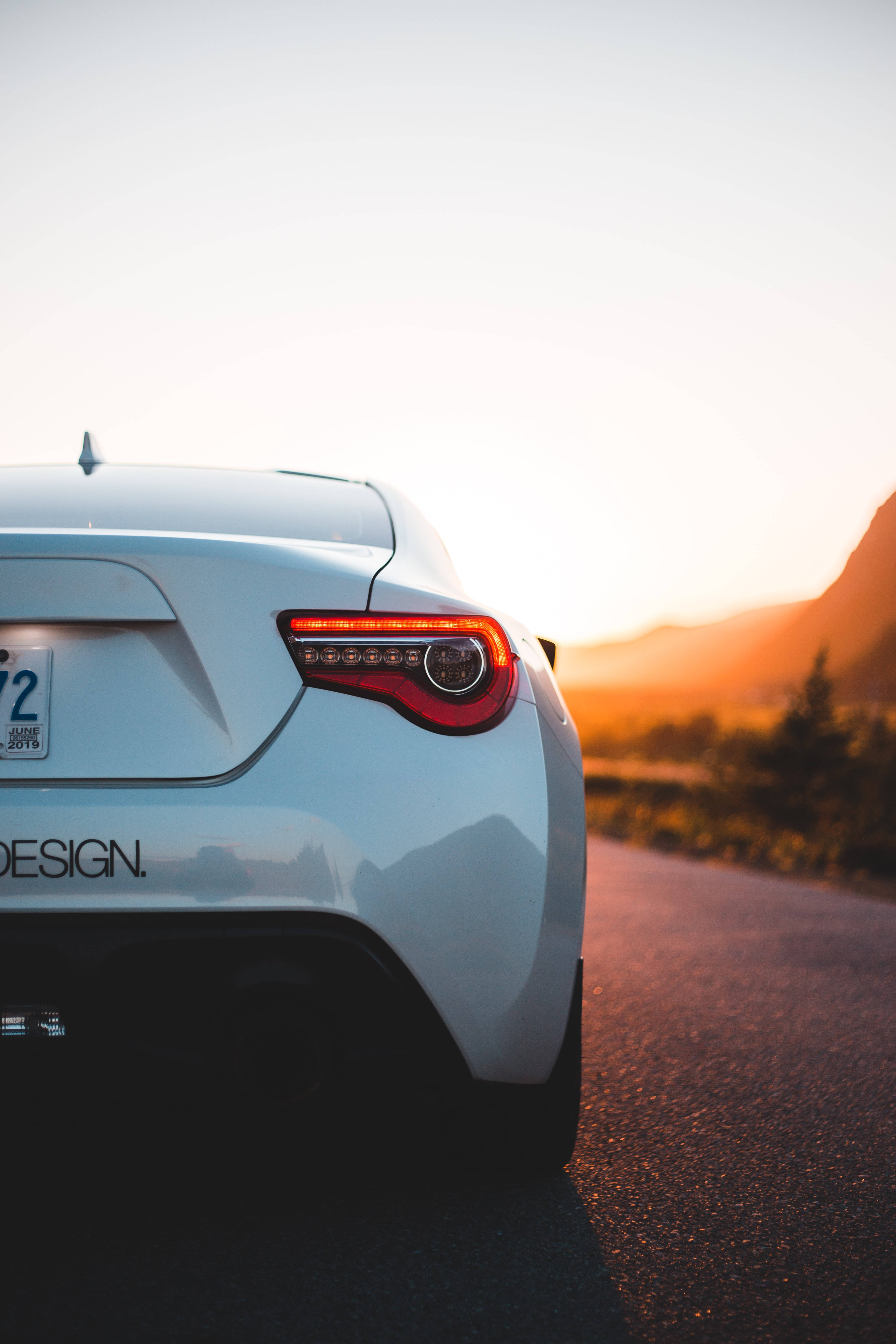 white Toyota car, rear view, sunset light, 5K Phone Wallpaper