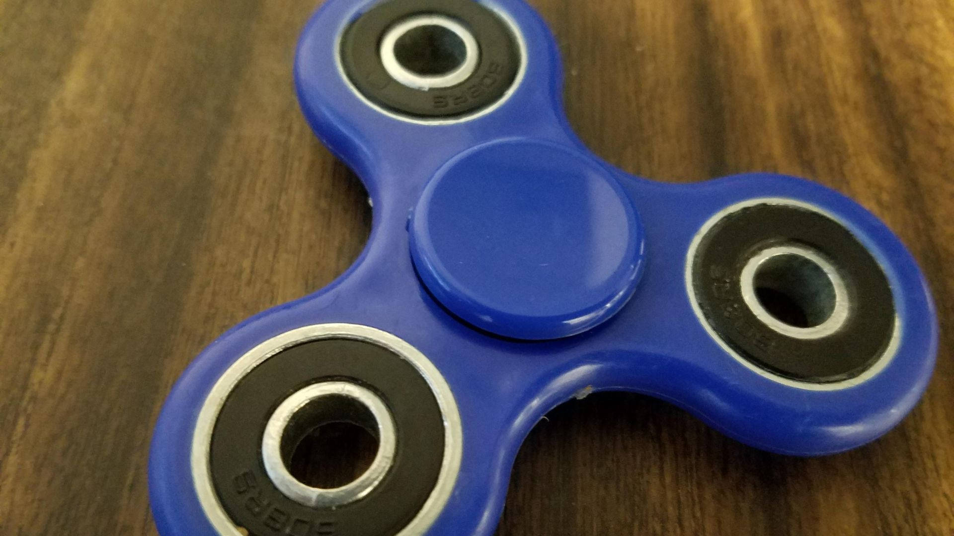 blue fidget spinner, wood, warm wooden surface, Full HD Desktop Wallpaper