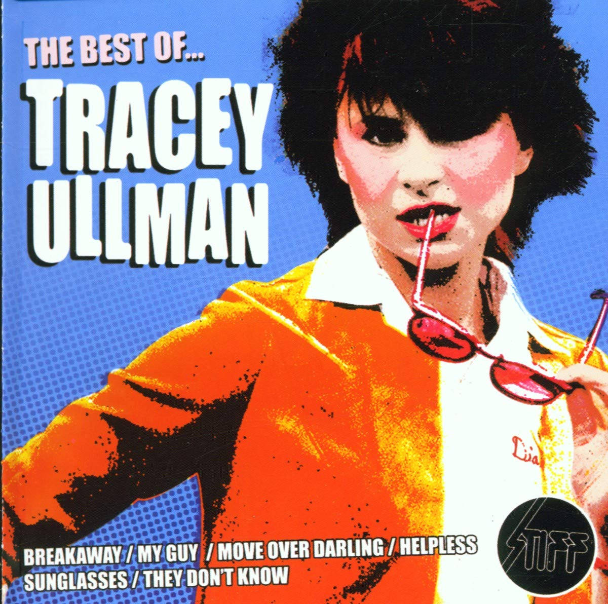 Tracey Ullman, bold orange jacket, vibrant blue background, SD Desktop Wallpaper