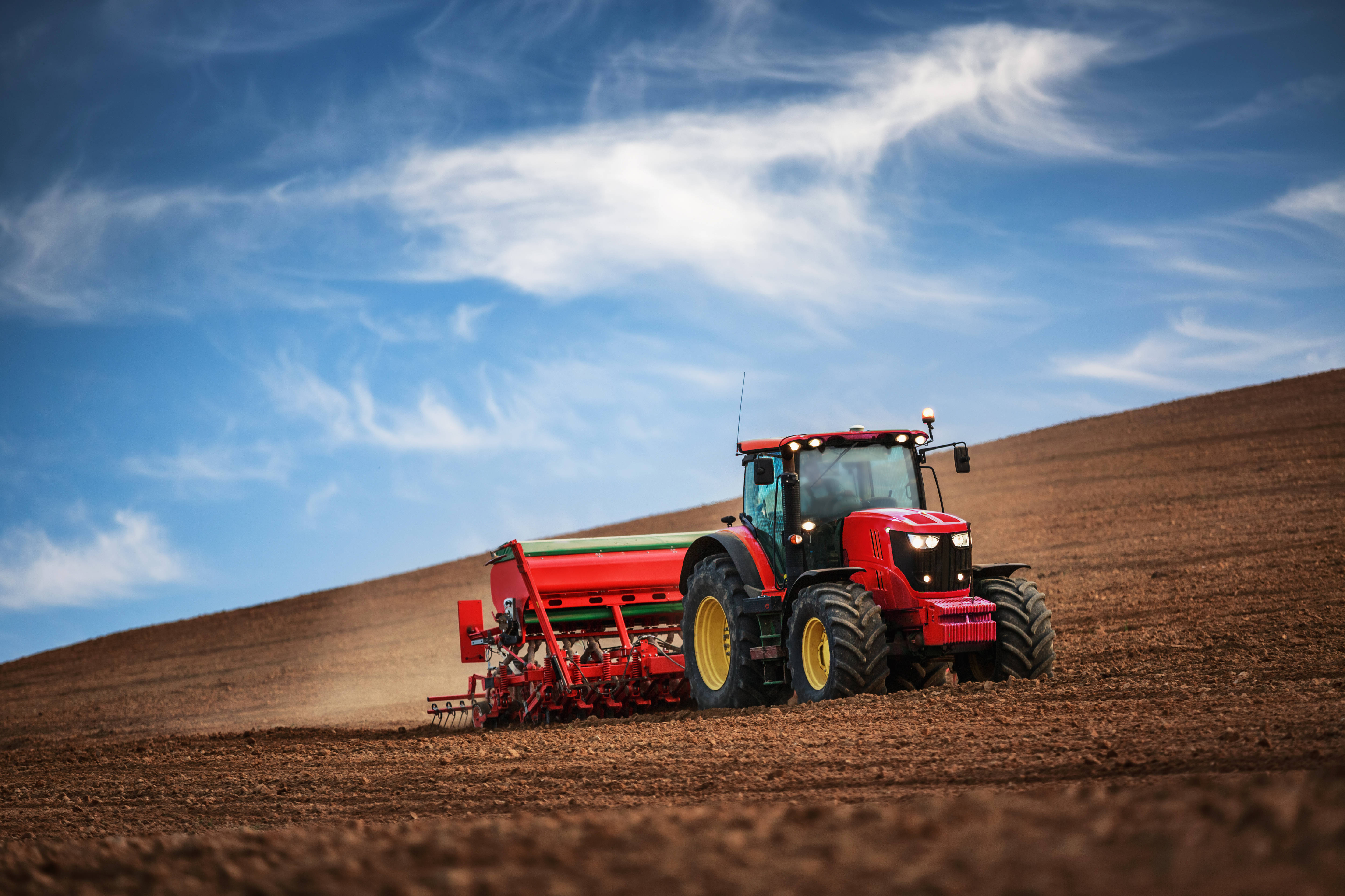 red tractor, yellow wheels, brown field, 5K Desktop Wallpaper