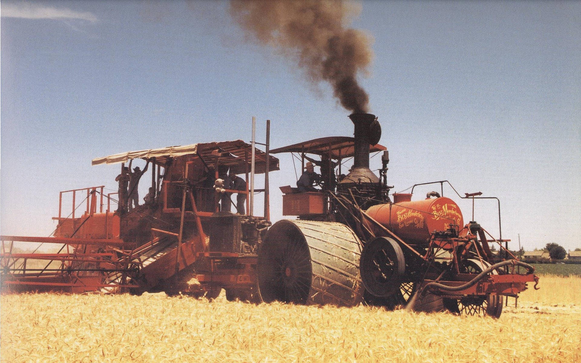 vintage red steam-powered reaper, golden wheat, clear blue sky, Full HD Desktop Wallpaper