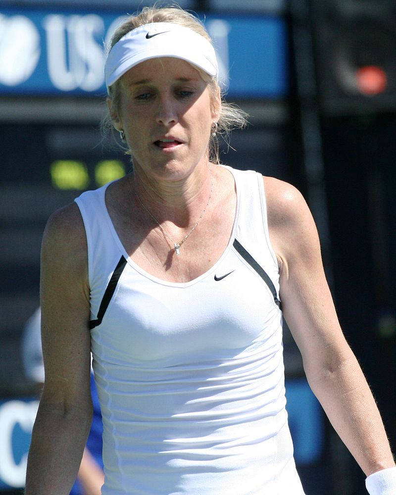Tracy Austin, white athletic gear, sunlit court, SD Phone Wallpaper