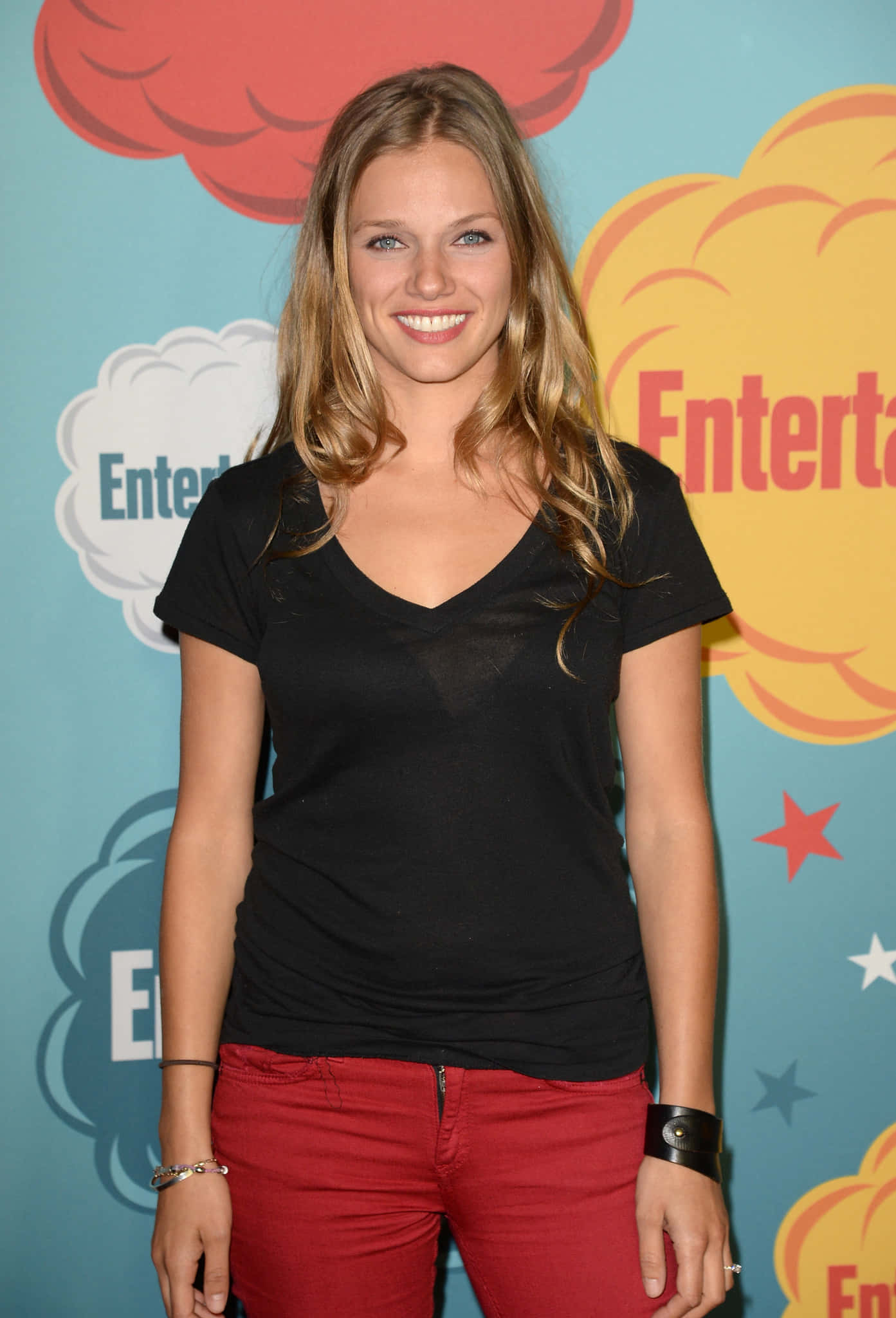 Tracy Spiridakos, black tee, red pants, Full HD Phone Wallpaper
