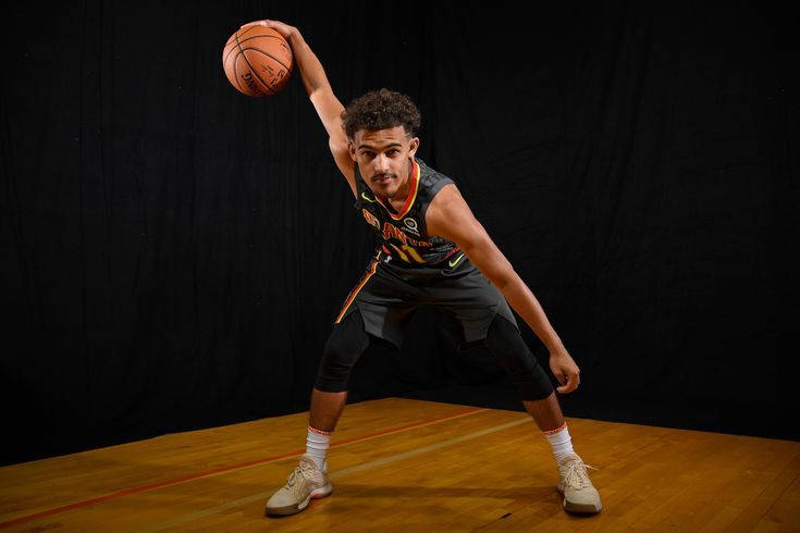 Trae Young, black jersey, wooden court, SD Desktop Wallpaper