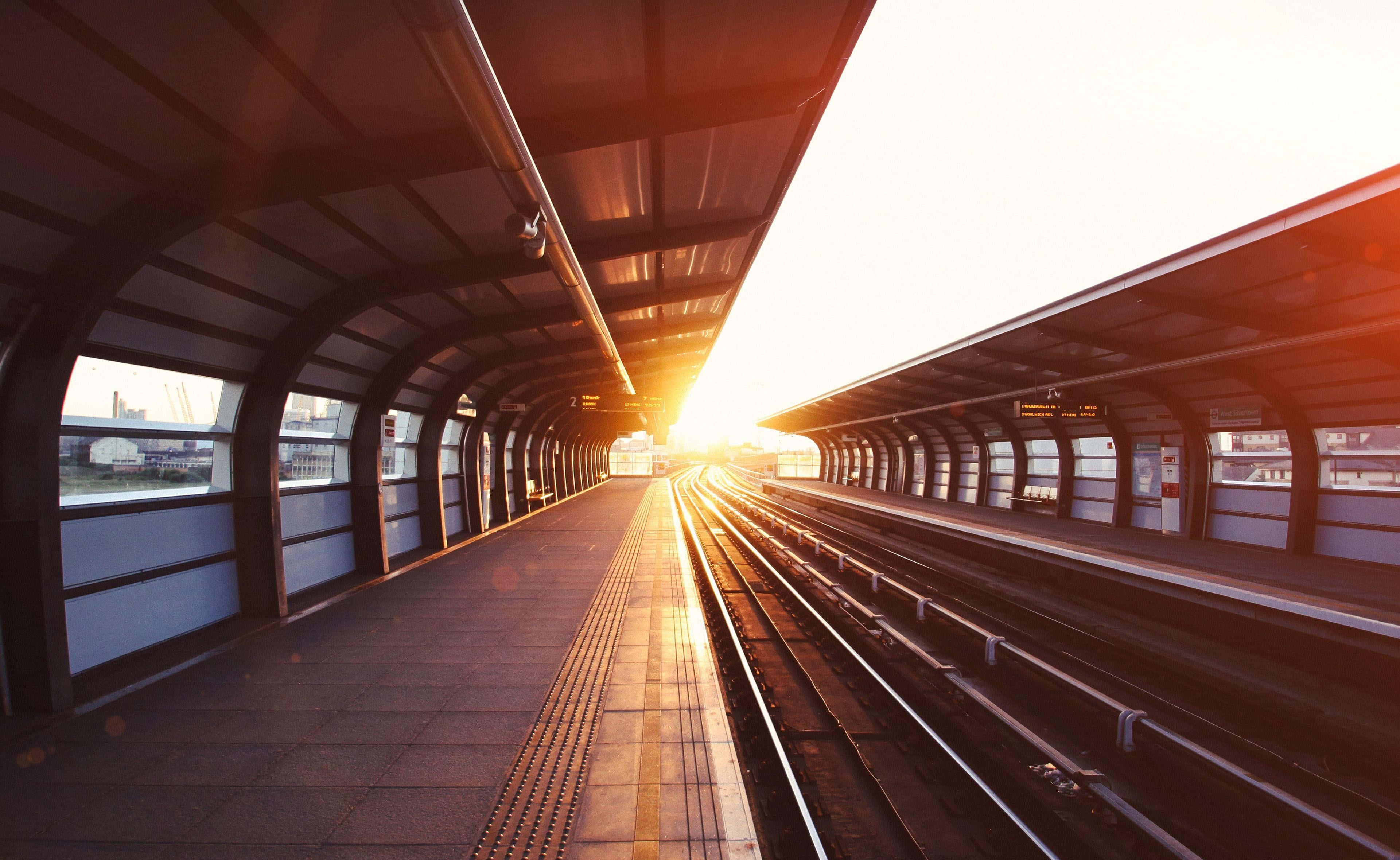 sunset glow, elevated train station tunnel, golden rays, 4K Desktop Wallpaper